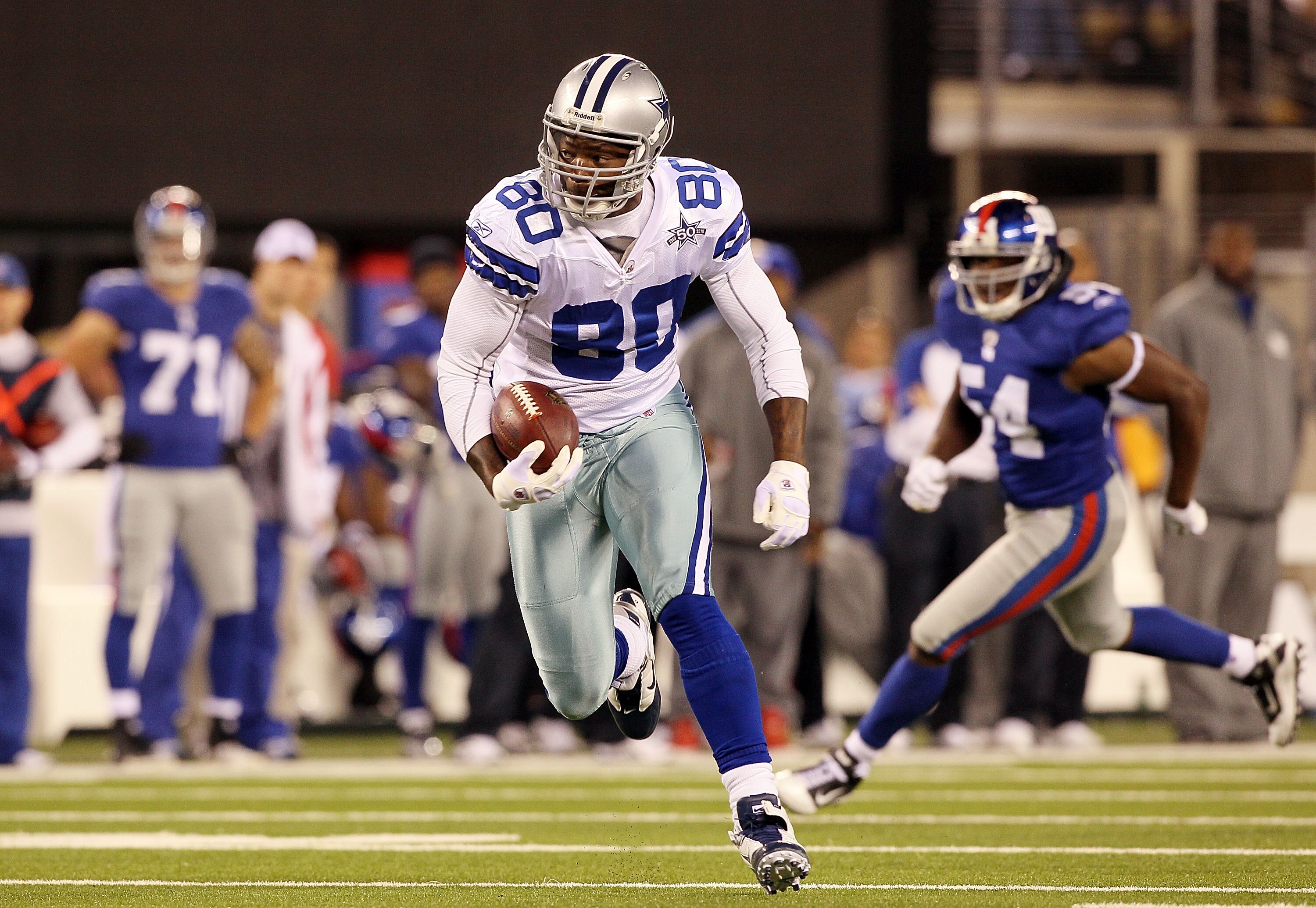 EAST RUTHERFORD, NJ - NOVEMBER 14: Martellus Bennett #80 of the Dallas Cowboys runs a reception against the New York Giants on November 14, 2010 at the New Meadowlands Stadium in East Rutherford, New Jersey.  (Photo by Jim McIsaac/Getty Images)