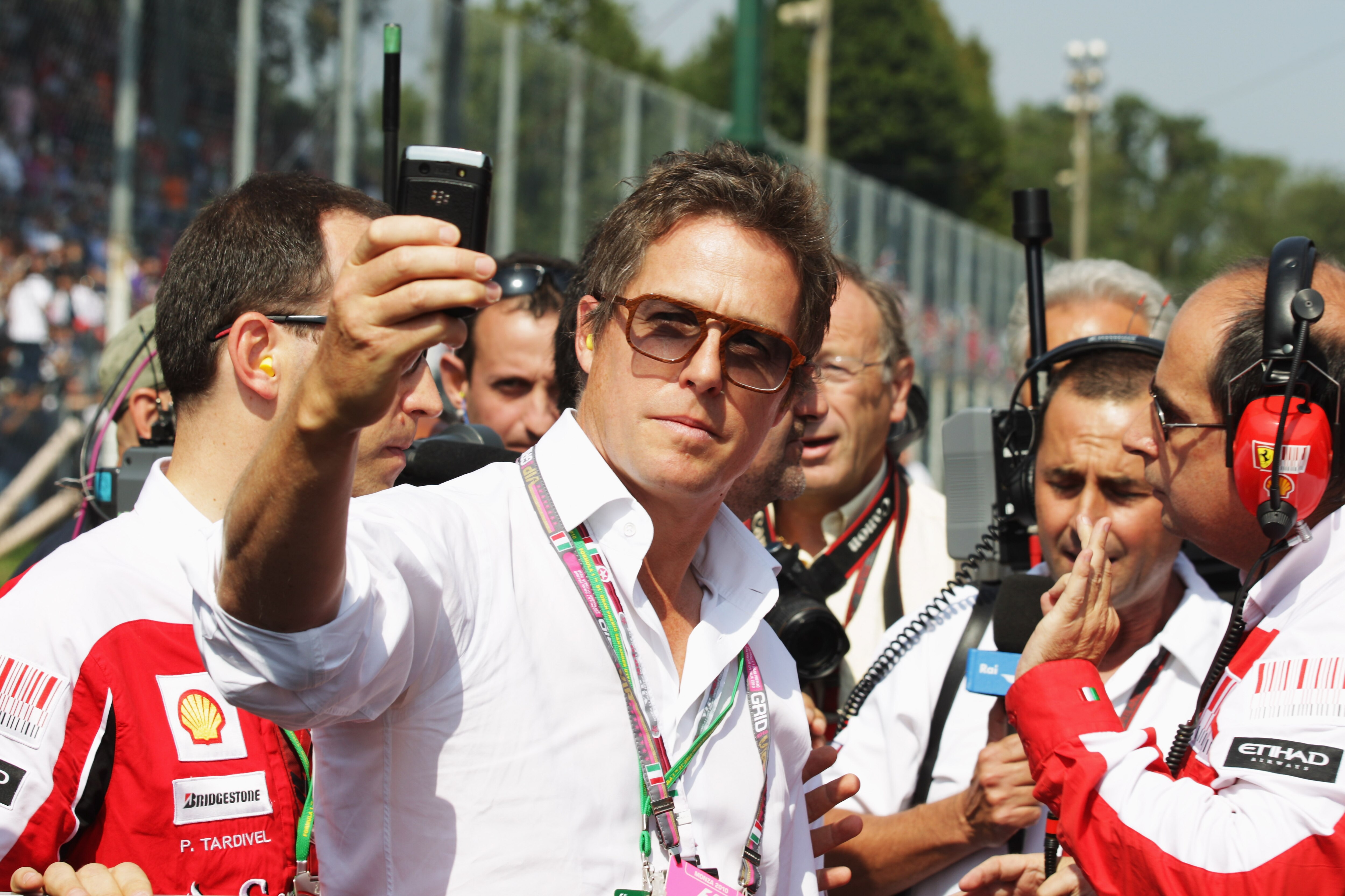 MONZA, ITALY - SEPTEMBER 12:  Actor Hugh Grant is seen on the grid before the Italian Formula One Grand Prix at the Autodromo Nazionale di Monza on September 12, 2010 in Monza, Italy.  (Photo by Mark Thompson/Getty Images)