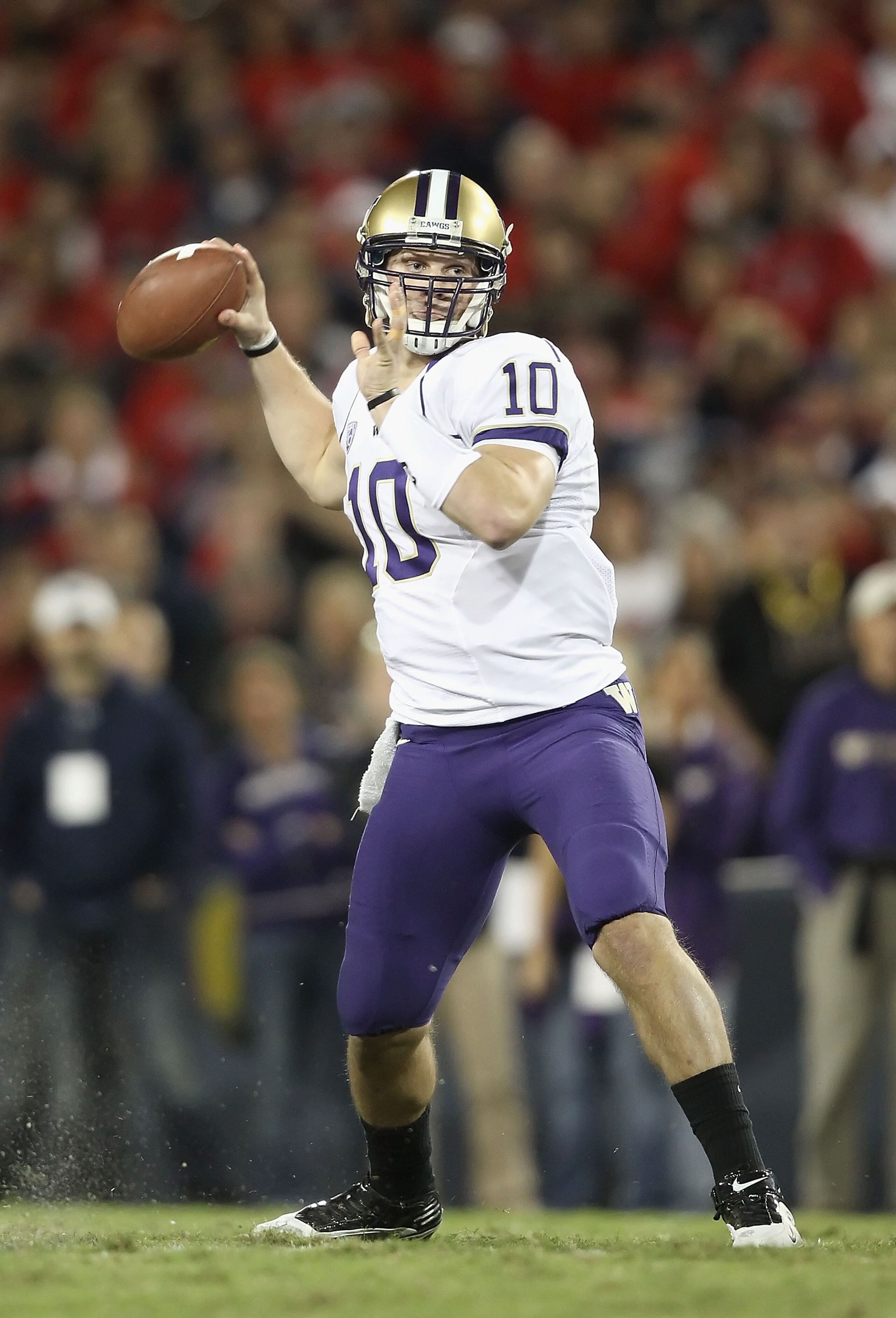 TUCSON, AZ - OCTOBER 23: Quarterback Jake Locker #10 of the Washington Huskies drops back to pass during the college football game against the Arizona Wildcats at Arizona Stadium on October 23, 2010 in Tucson, Arizona. The Wildcats defeated the Huskies 4 TUCSON, AZ - OCTOBER 23: Quarterback Jake Locker #10 of the Washington Huskies drops back to pass during the college football game against the Arizona Wildcats at Arizona Stadium on October 23, 2010 in Tucson, Arizona. The Wildcats defeated the Huskies 4