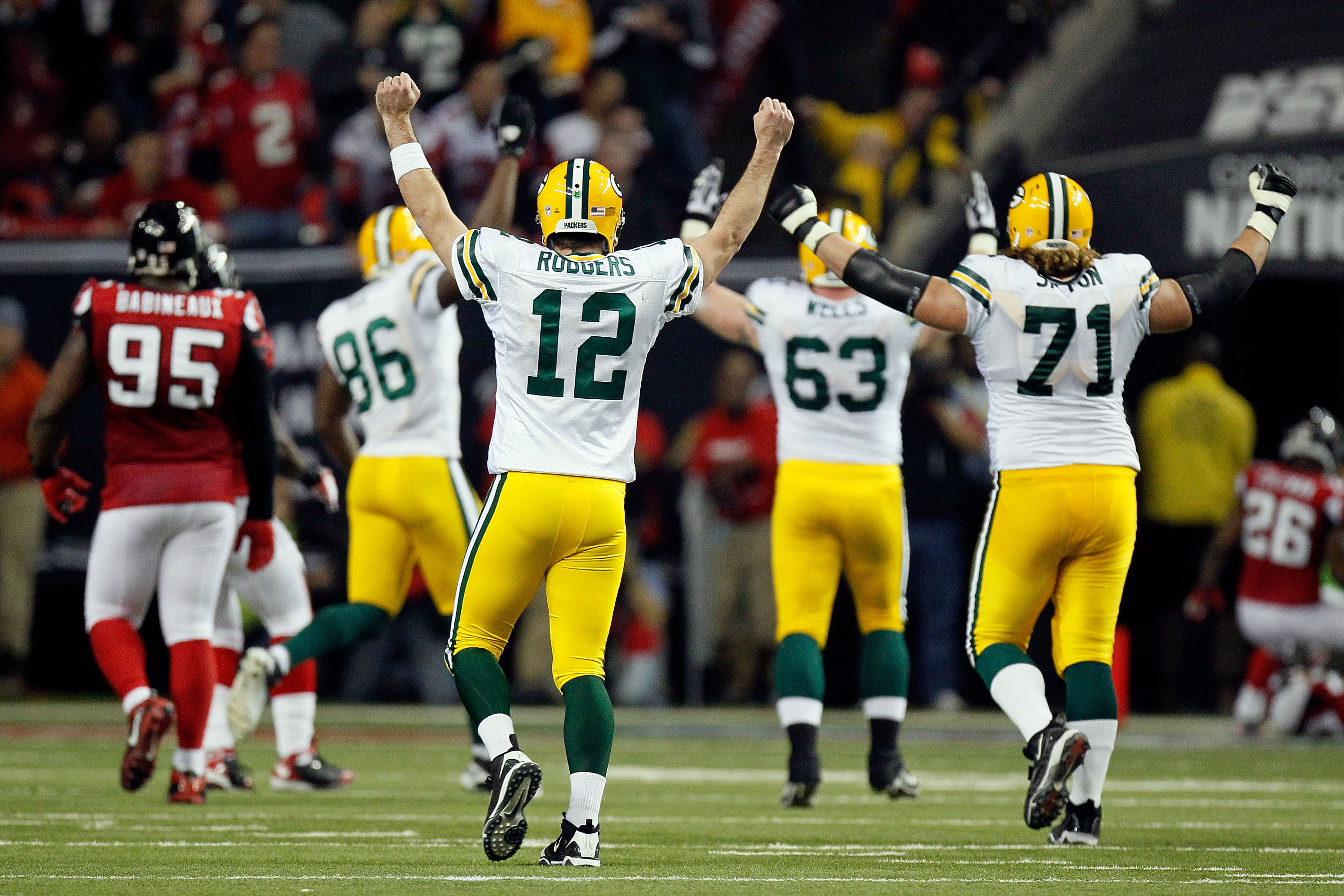 ATLANTA, GA - JANUARY 15:  Aaron Rodgers #12 of the Green Bay Packers reacts after he threw a 20-yard touchdown pass to James Jones #89 against the Atlanta Falcons during their 2011 NFC divisional playoff game at Georgia Dome on January 15, 2011 in Atlant