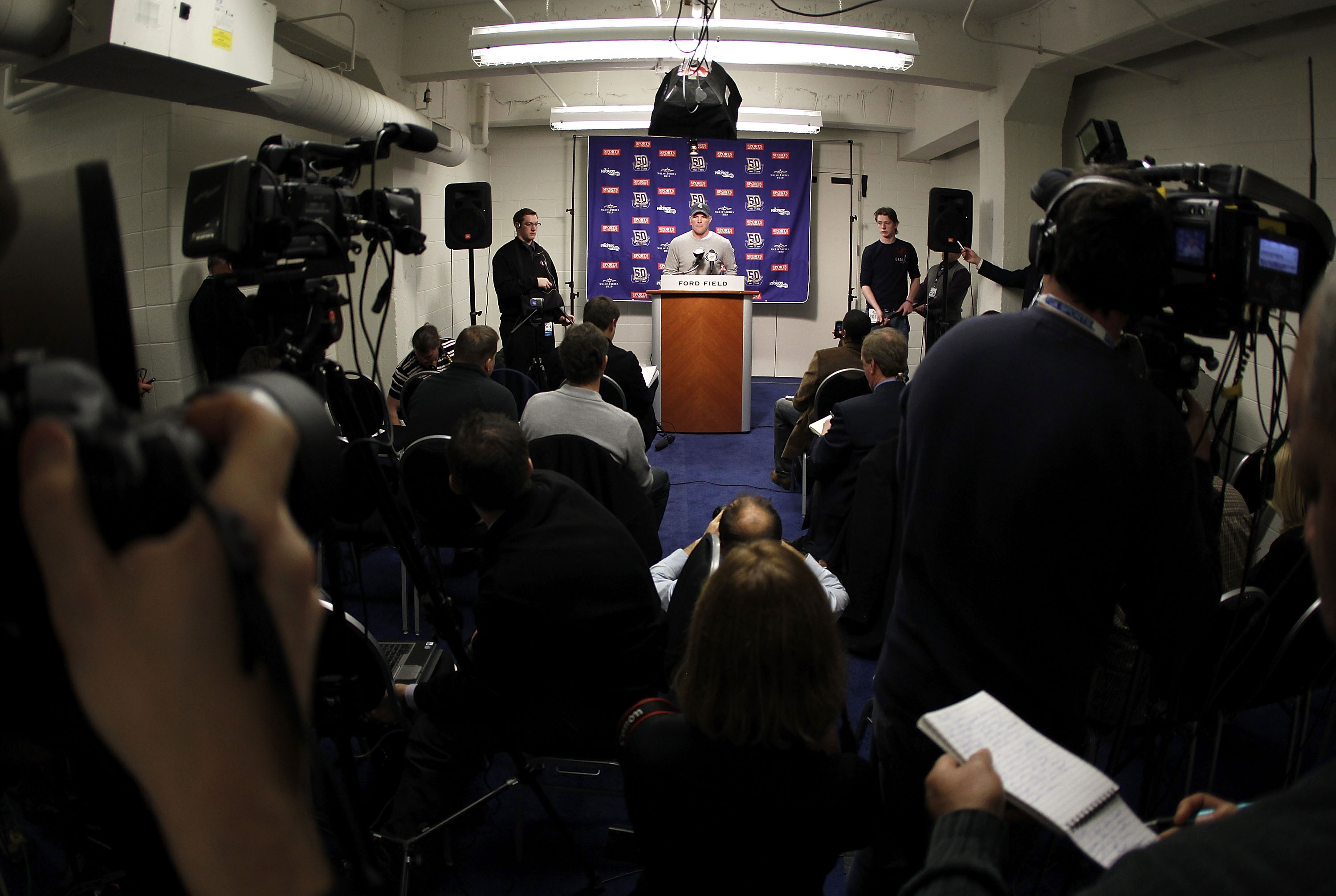 DETROIT, MI - JANUARY 02:  Brett Favre #4 of the Minnesota Vikings talks at a post game press conference after a 13-20 loss to the Detroit Lions at Ford Field on January 2, 2011 in Detroit, Michigan.  (Photo by Gregory Shamus/Getty Images)