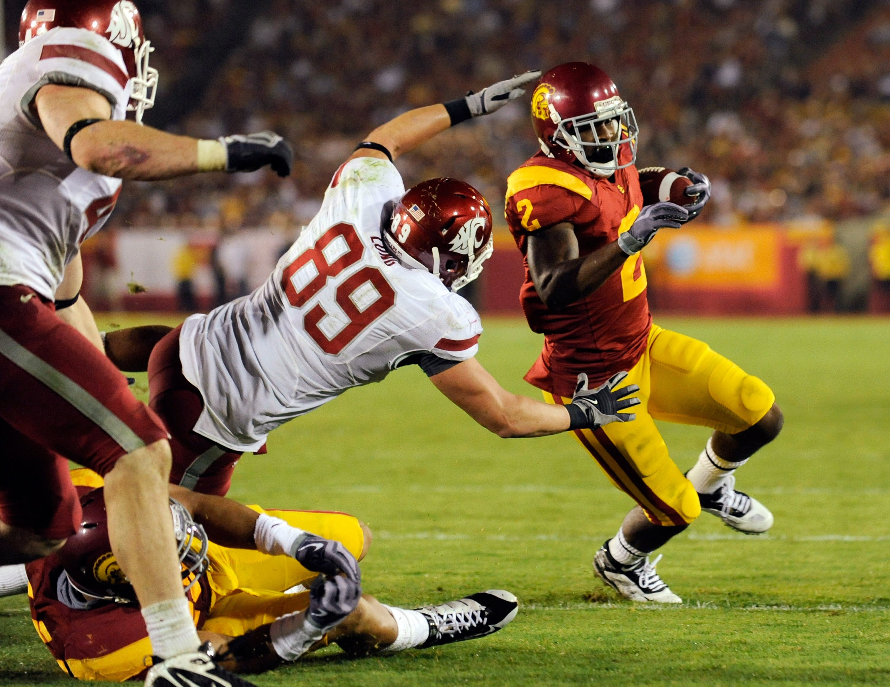 LOS ANGELES, CA - SEPTEMBER 26: C.J. Gable #2 of the USC Trojans is stopped short of scoring a touchdown by defense of Washington State Cougars  during the fourth quarter of the college football game at the Los Angeles Memorial Coliseum on September 26, 2