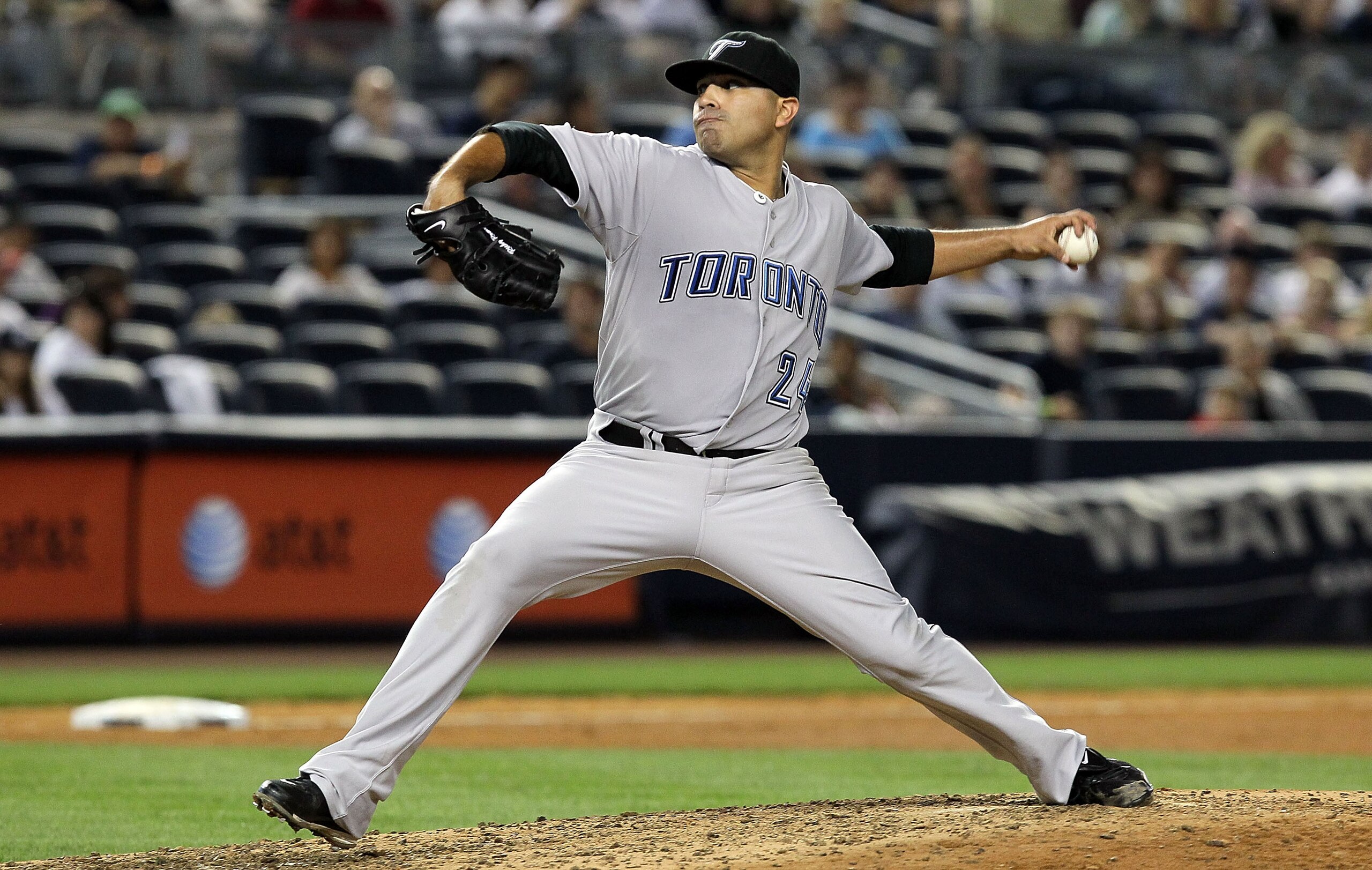 NEW YORK - AUGUST 03:  Ricky Romero #24 of the Toronto Blue Jays delivers a pitch against the New York Yankees on August 3, 2010 at Yankee Stadium in the Bronx borough of New York City.The Jays defeated the Yankees 8-2.  (Photo by Jim McIsaac/Getty Images