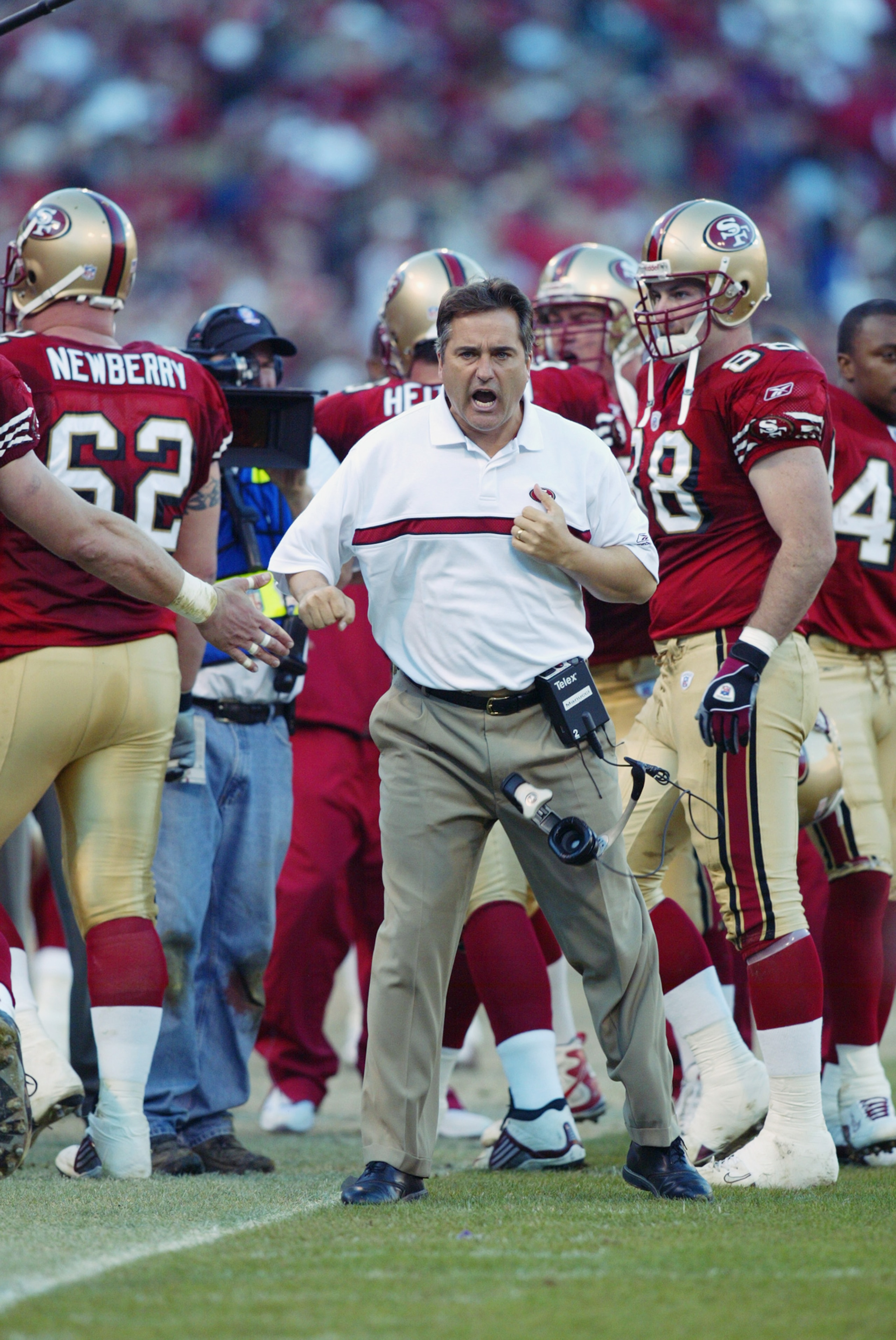 SAN FRANCISCO - JANUARY 5:  Head coach Steve Mariucci of the San Fransisco 49ers celebrates after Jeff Garcia's touchdown in the fourth quarter against the New York Giants in the NFC Wild Card game at 3Com Park on January 5, 2003 in San Francisco, Califor