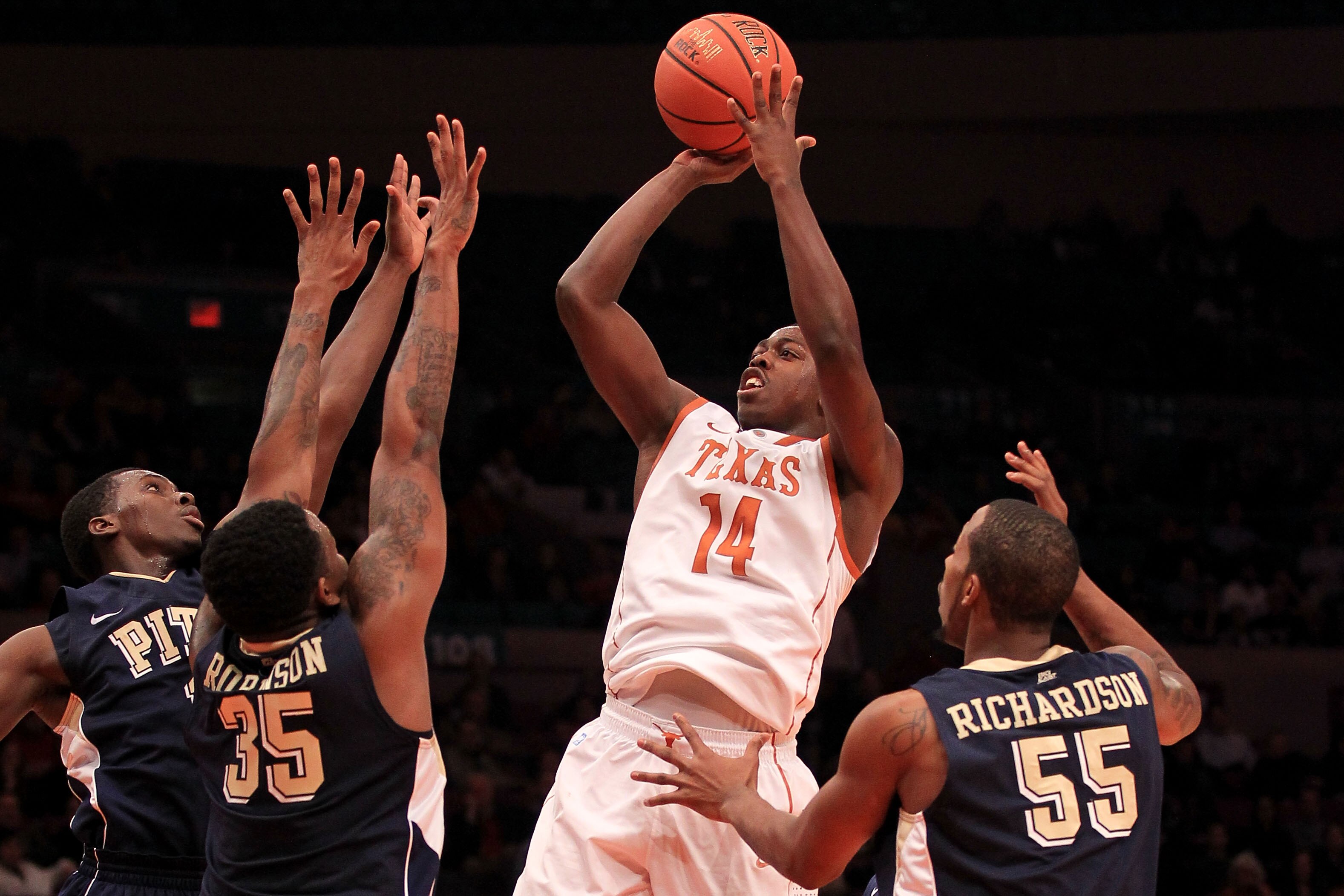 NEW YORK - NOVEMBER 19: J'Covan Brown #14 of the Texas Longhorns shoots over defenders from the  Pittsburgh Panthers during the Championship game of the 2k Sports Classic at Madison Square Garden on November 19, 2010 in New York, New York.  (Photo by Chri