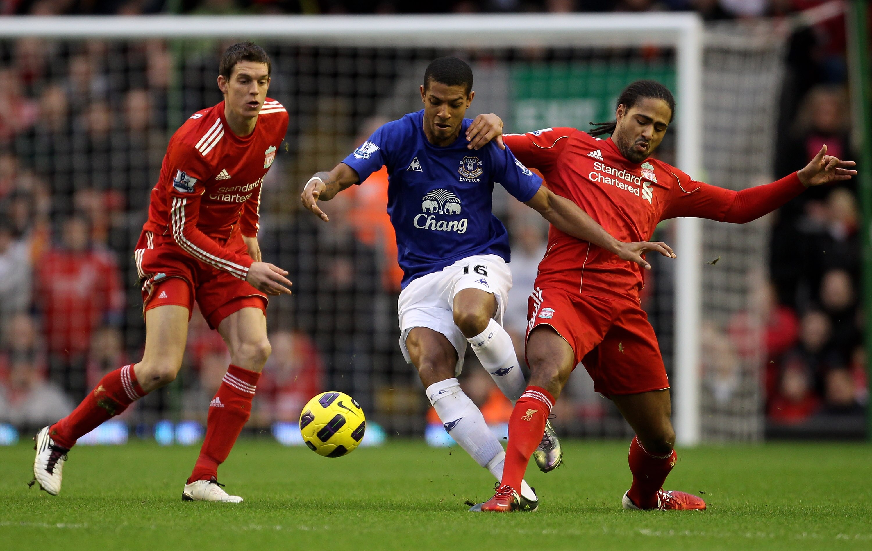Daniel Agger and Glen Johnson of Liverpool and Jermaine Beckford of Everton