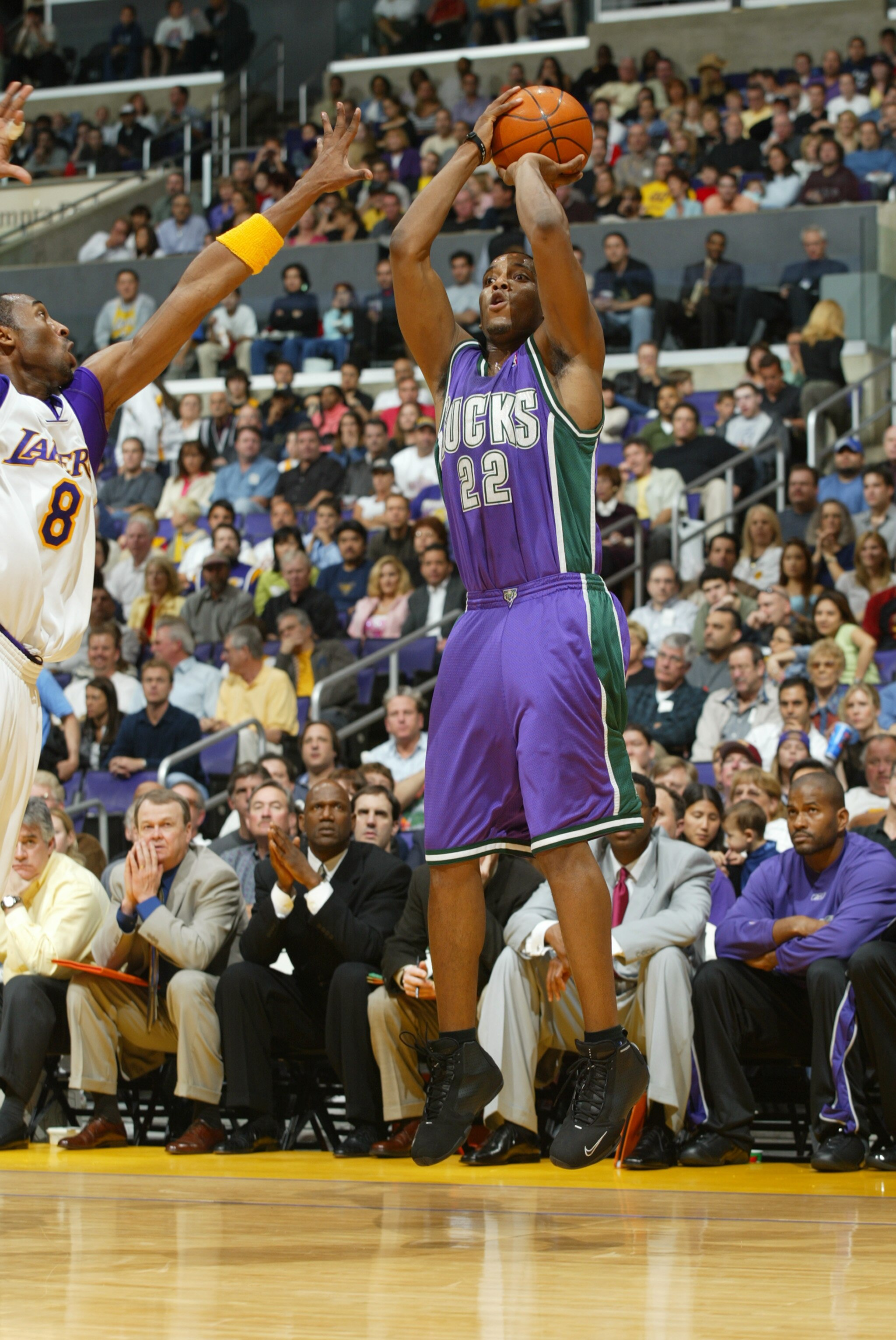 LOS ANGELES - MARCH 21:  Michael Redd #22 of the Milwaukee Bucks shoots a jumper over Kobe Bryant #8 of the Los Angeles Lakers during the game at the Staples Center on March 21, 2004 in Los Angeles, California.  The Lakers won 104-103 in overtime.   NOTE