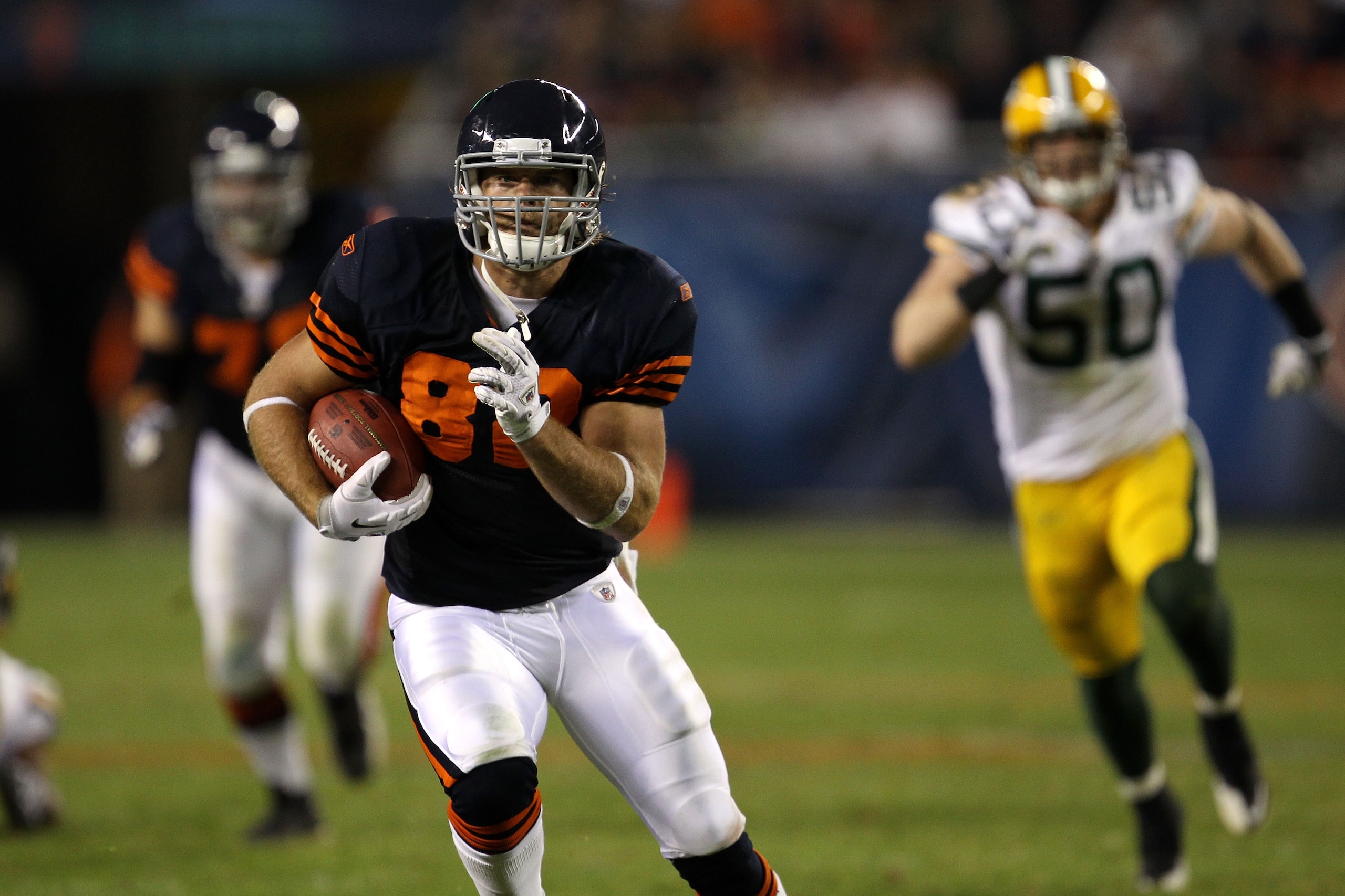 CHICAGO - SEPTEMBER 27:  Greg Olsen #82 of the Chicago Bears runs for yards after the catch against A.J. Hawk #50 of the Green Bay Packers at Soldier Field on September 27, 2010 in Chicago, Illinois. The Bears won 20-17.  (Photo by Jonathan Daniel/Getty I