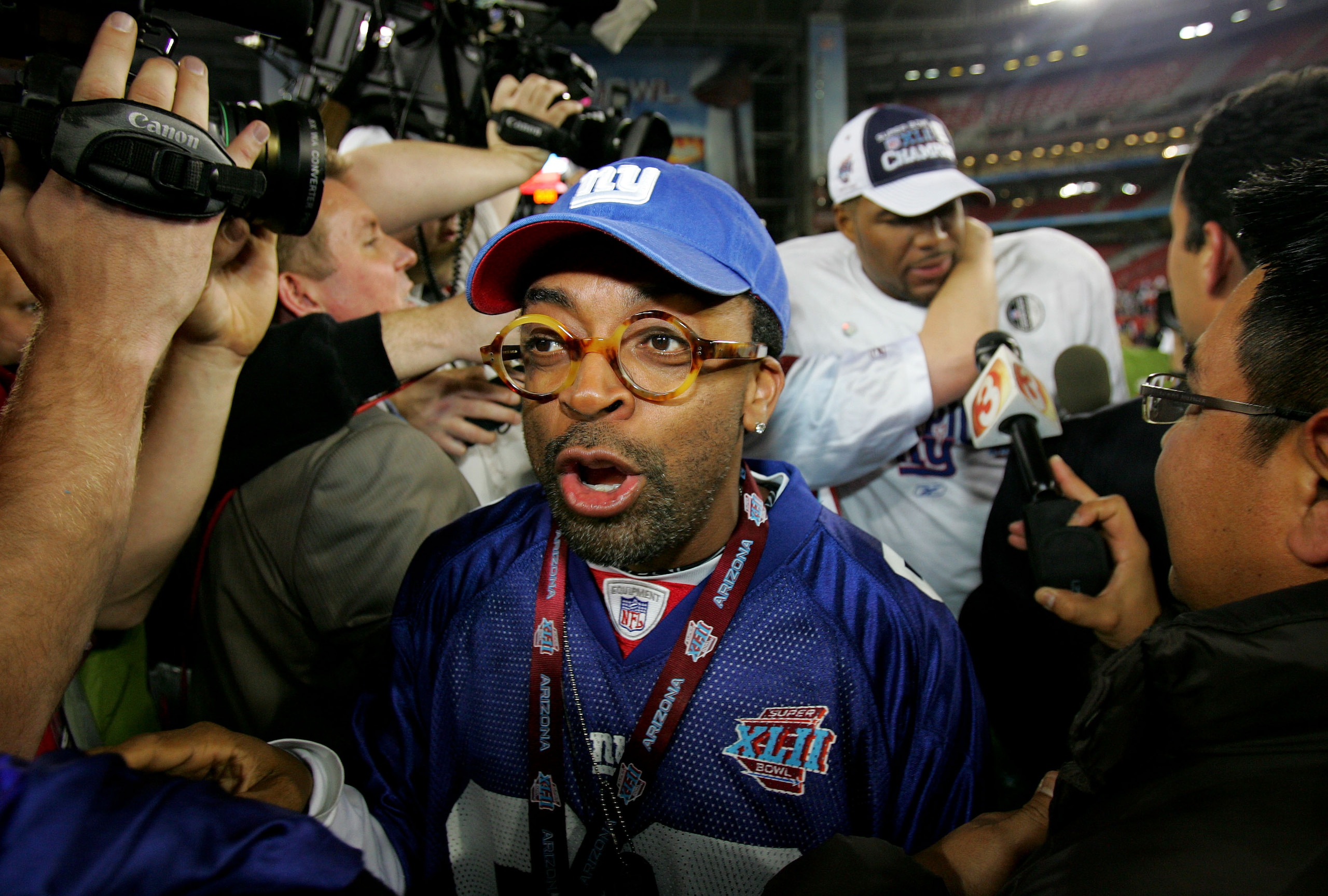 GLENDALE, AZ - FEBRUARY 03:  Actor Spike Lee celebrates on the field after the New York Giants defeated the New England Patriots 17-14 after Super Bowl XLII on February 3, 2008 at the University of Phoenix Stadium in Glendale, Arizona.  (Photo by Streeter