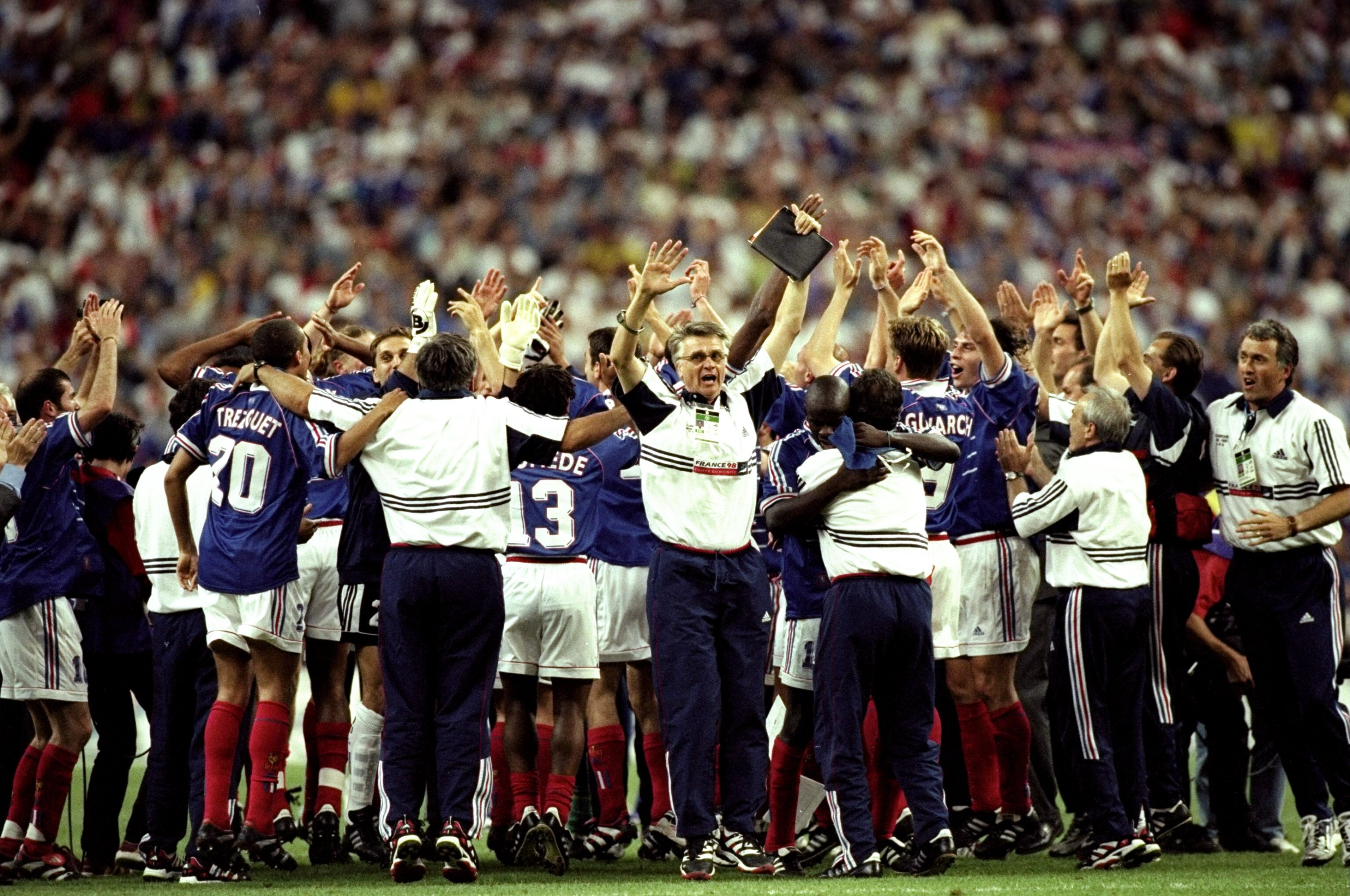 12 Jul 1998:  Joy for France as coach Aime Jacquet celebrates with his team after victory in the World Cup Final against Brazil at the Stade de France in St Denis. France won 3-0. \ Mandatory Credit: Clive Brunskill /Allsport