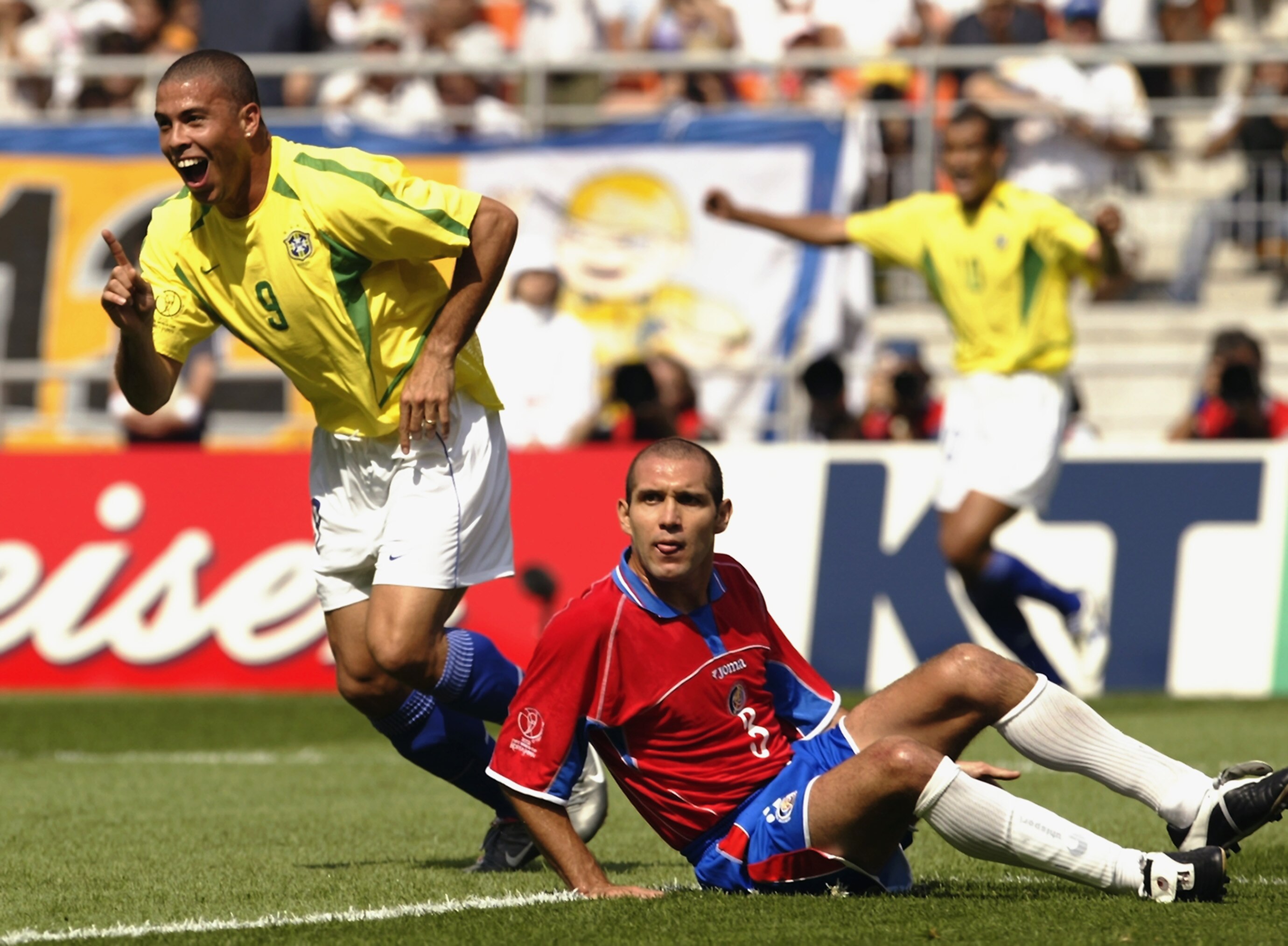 SUWON - JUNE 13:  Ronaldo of Brazil leaves Luis Marin of Costa Rica helpless as he scores during the Brazil v Costa Rica, Group C, World Cup Group Stage match played at the Suwon World Cup Stadium in Suwon, South Korea on June 13, 2002. Brazil won 5-2.  (