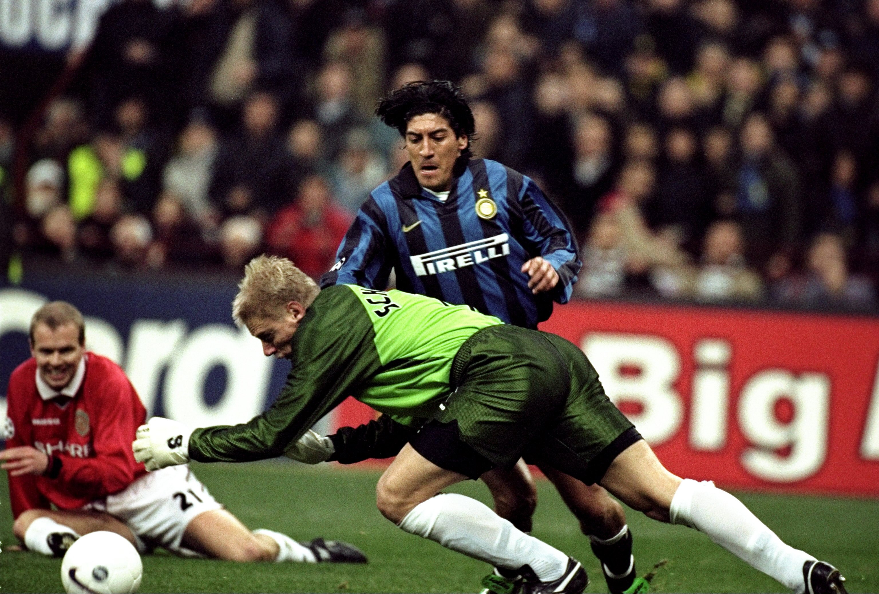 17 Mar 1999:  Peter Schmiechel of Manchester United clatters into Ivan Zamorano of Inter Milan but no penalty is awarded in the UEFA Champions League quarter-final second leg match at the San Siro in Milan, Italy. United went through 3-1 on aggregate afte