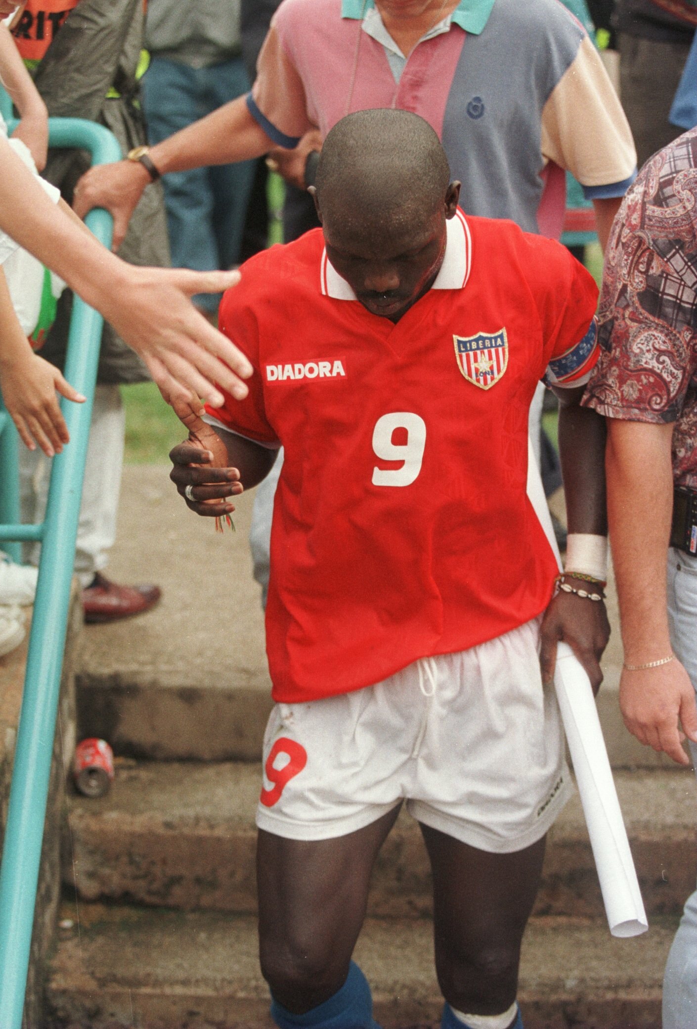 25 January, 1996: George Weah of Liberia walks off dejected after Liberia are knocked out of the African Cup of Nations after their 2-0 defeat by Liberia at the FNB Stadium, Johannesburg. Zaire now qualify for the Quarter Finals, whilst George Weah's Libe