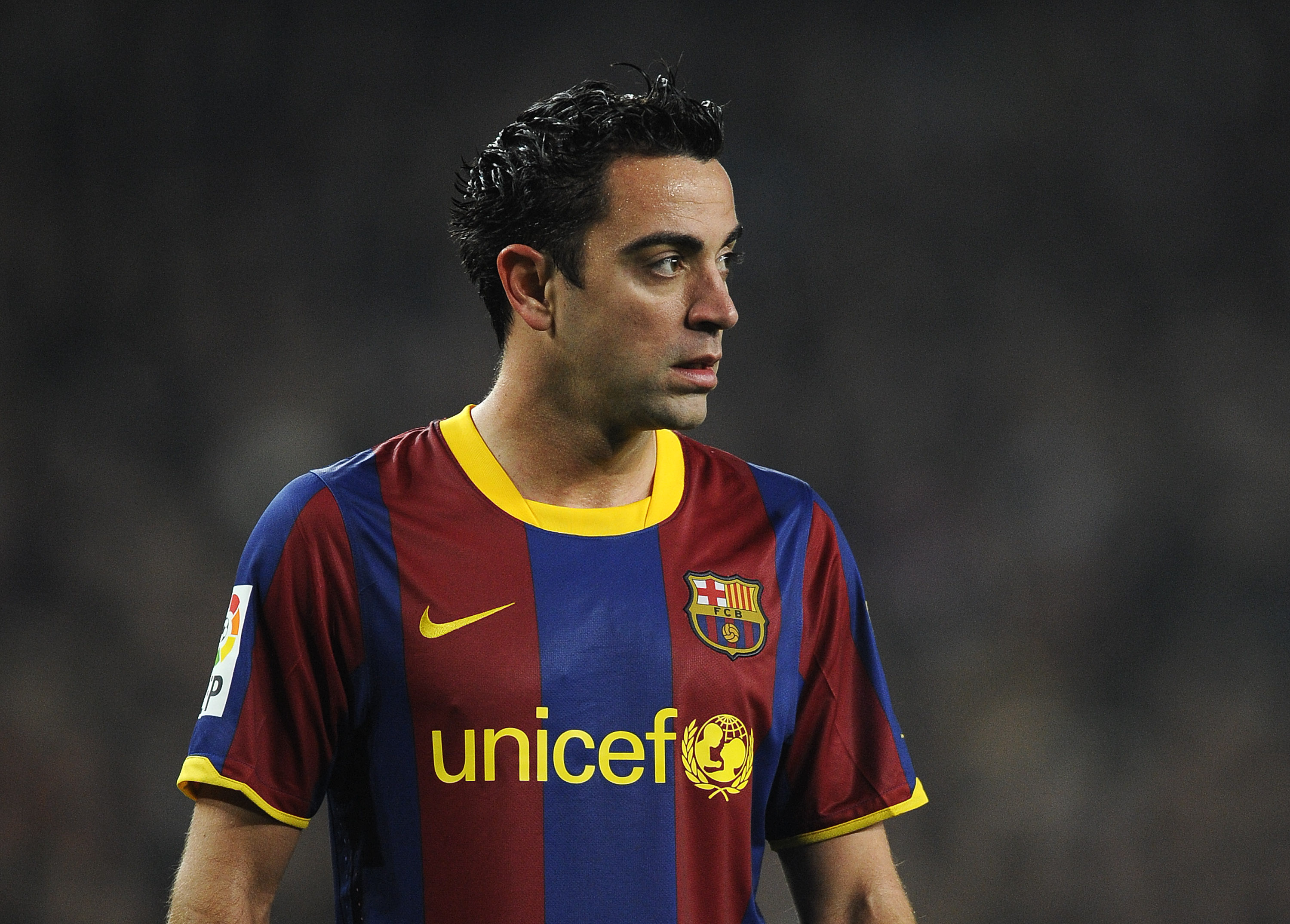 BARCELONA, SPAIN - JANUARY 16:  Xavi Hernandez of FC Barcelona looks on during the La Liga match between FC Barcelona and Malaga at Nou Camp on January 16, 2011 in Barcelona, Spain. Barcelona won 4-1.  (Photo by David Ramos/Getty Images)