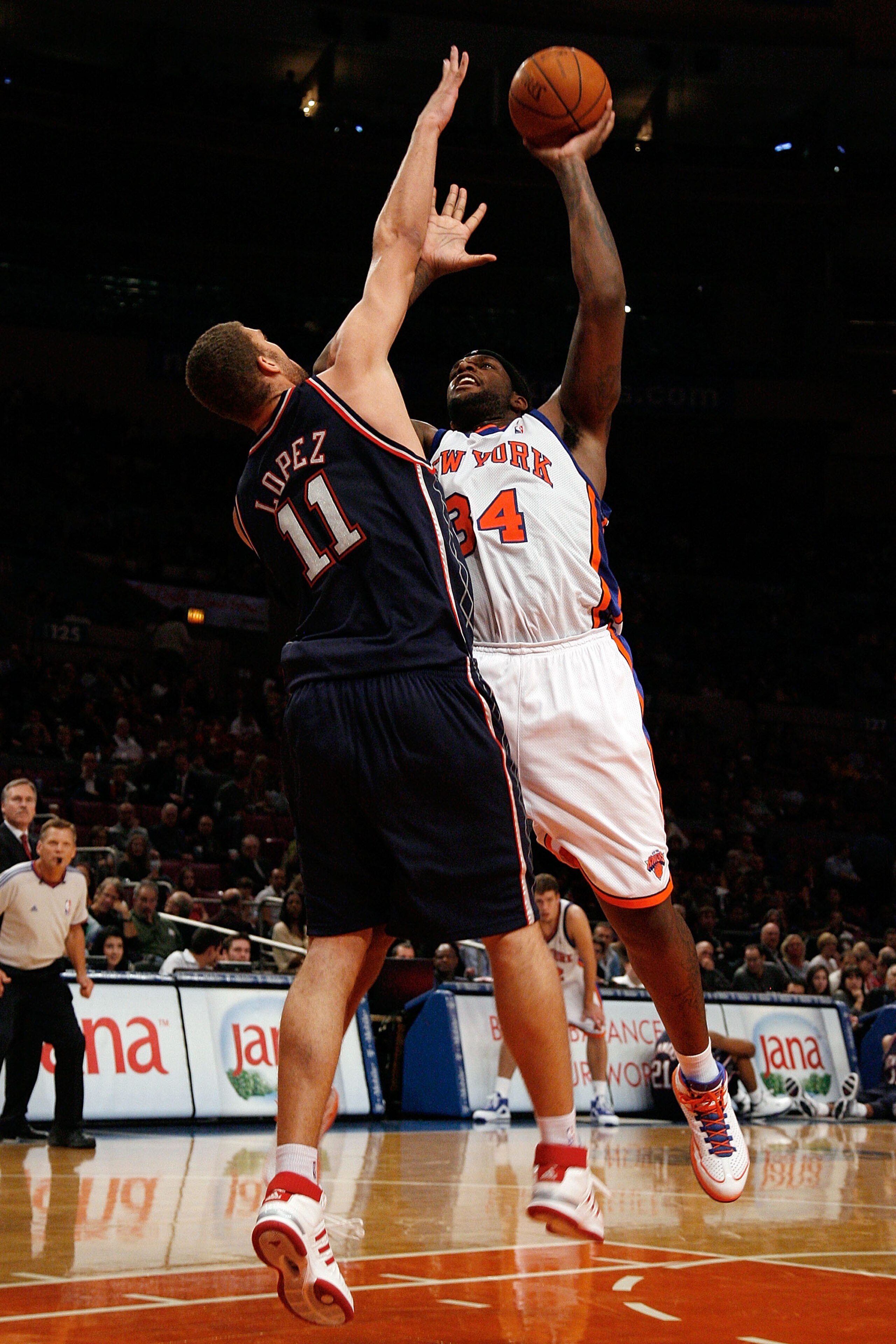 NEW YORK - OCTOBER 24:  Brook Lopez #11 of the New Jersey Nets tries to block a shot by Eddy Curry #34 of the New York Knicks during the first half of a preseason game on October 24, 2008 at Madison Square Garden in New York City. NOTE TO USER: User expre