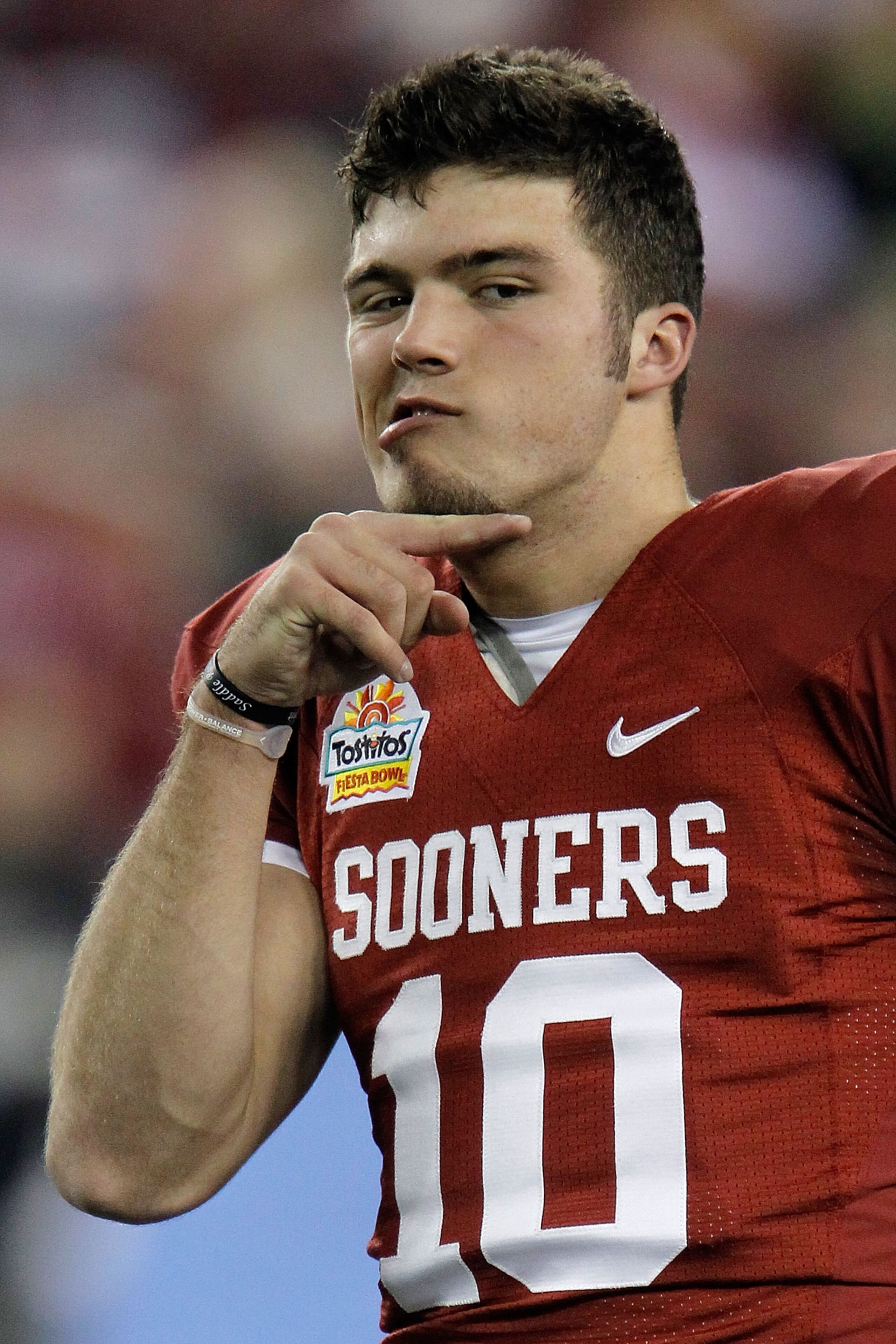 GLENDALE, AZ - JANUARY 01:  Quarterback Blake Bell #10 the Oklahoma Sooners makes a gesture before the Sooners take on the Connecticut Huskies in the Tostitos Fiesta Bowl at the Universtity of Phoenix Stadium on January 1, 2011 in Glendale, Arizona.  (Pho