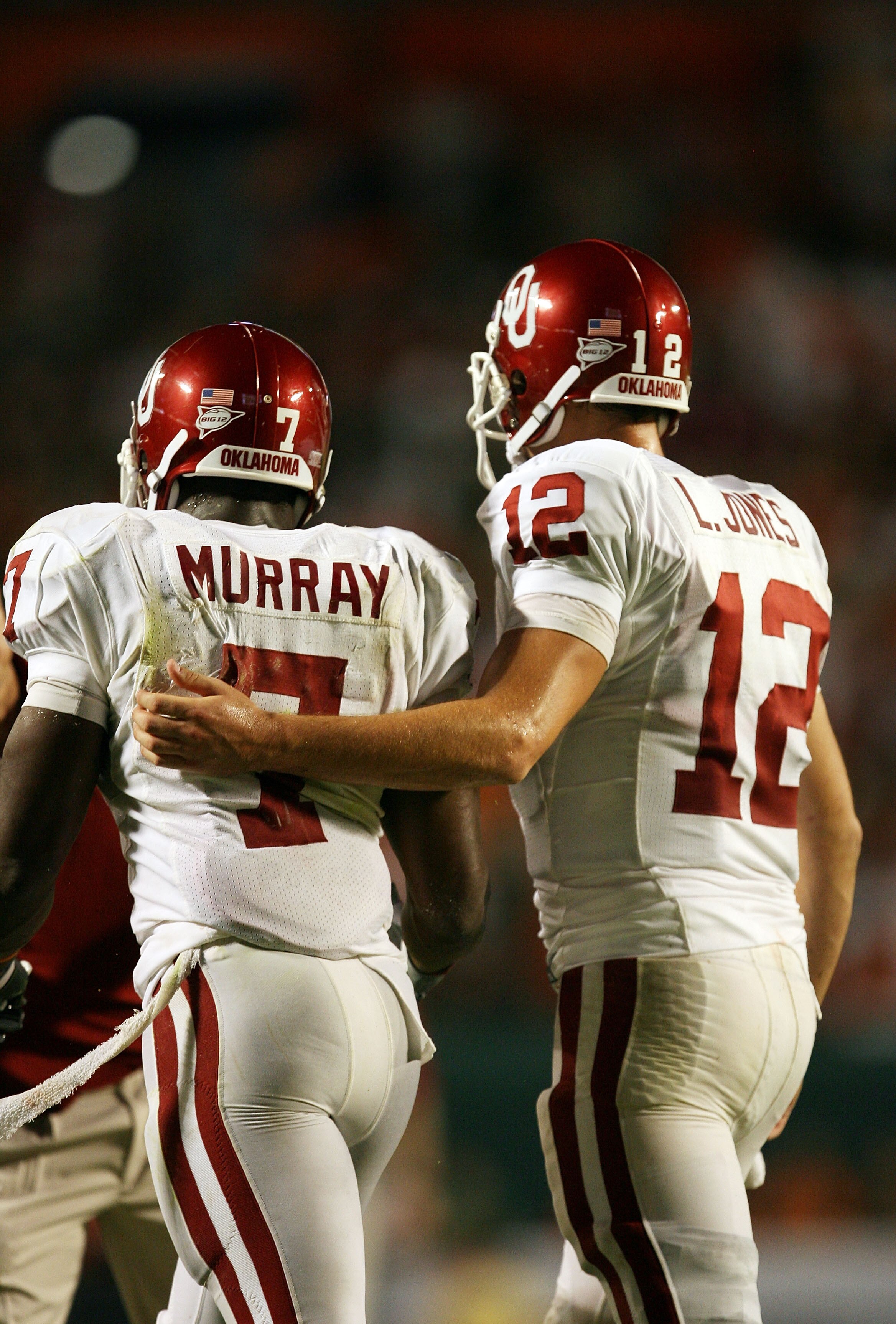 FORT LAUDERDALE, FL - OCTOBER 03: Quarterback Landry Jones #12 of the Oklahoma Sooners congratulates congratulates running back DeMarco Murray #7 after Murray's touchdown run in the third quarter against the Miami Hurricanes at Land Shark Stadium on Octob