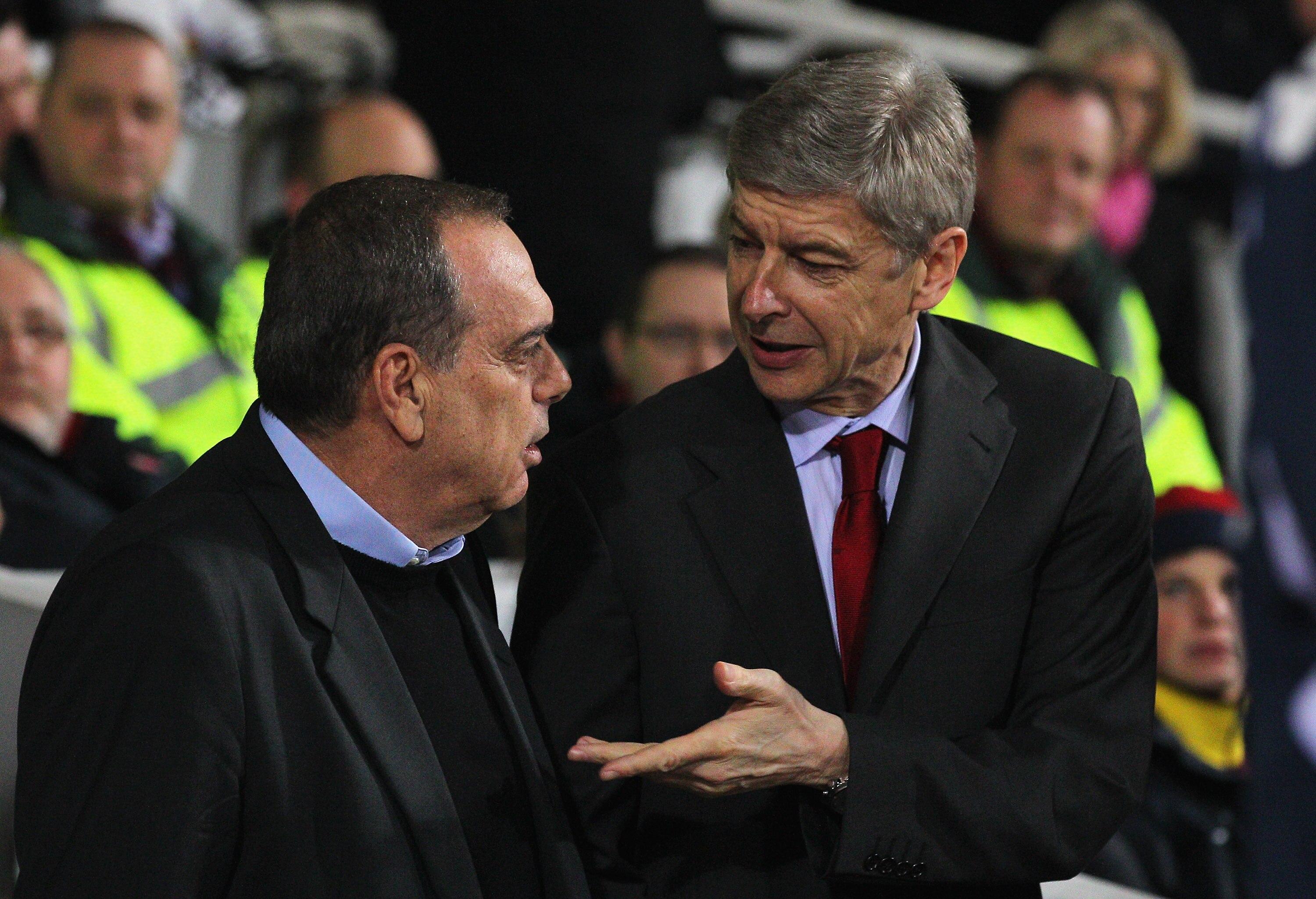 LONDON, ENGLAND - JANUARY 15:  Avram Grant (L), manager of West Ham United talks to Arsene Wenger, Manager of Arsenal ahead of the Barclays Premier League match between West Ham United and Arsenal at the Boleyn Ground on January 15, 2011 in London, Englan