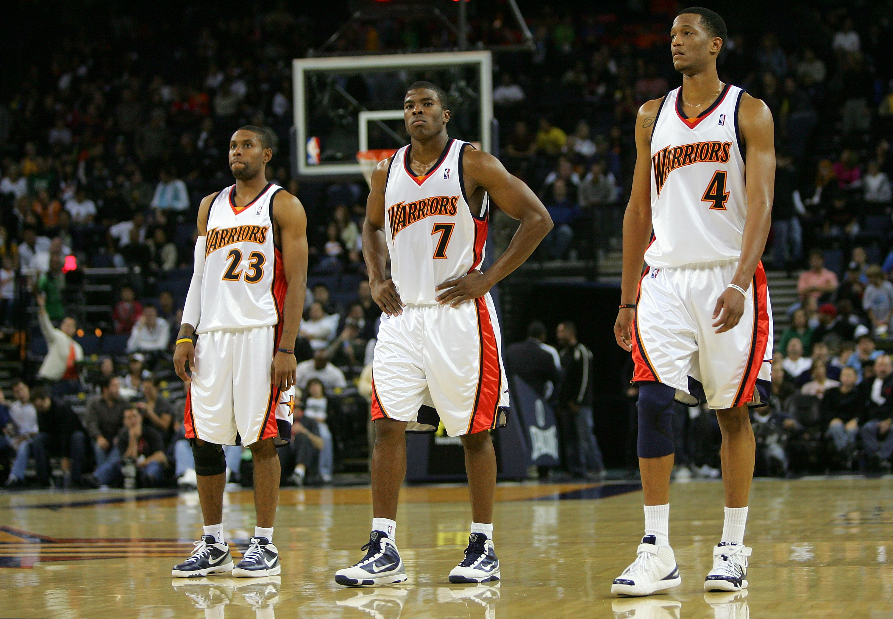 OAKLAND, CA - NOVEMBER 06:   C.J. Watson #23, Kelenna Azubuike #7 and Anthony Randolph #4 of the Golden State Warriors walk back on to the court after a time out late in their loss to the Los Angeles Clippers at Oracle Arena on November 6, 2009 in Oakland