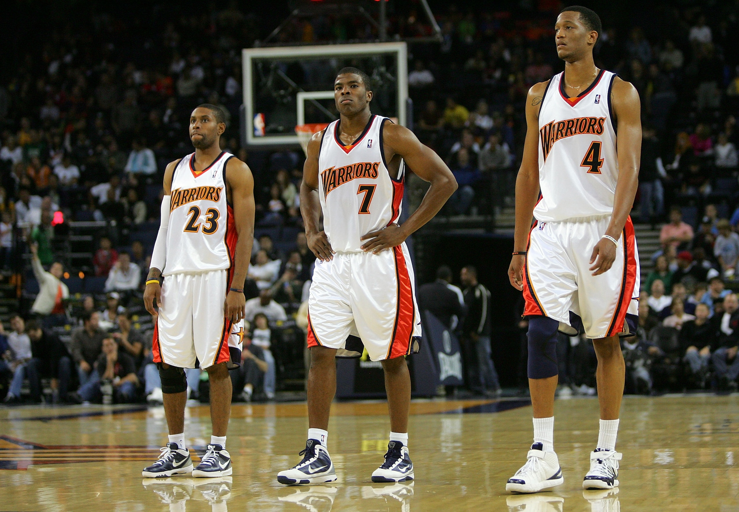OAKLAND, CA - NOVEMBER 06:   C.J. Watson #23, Kelenna Azubuike #7 and Anthony Randolph #4 of the Golden State Warriors walk back on to the court after a time out late in their loss to the Los Angeles Clippers at Oracle Arena on November 6, 2009 in Oakland