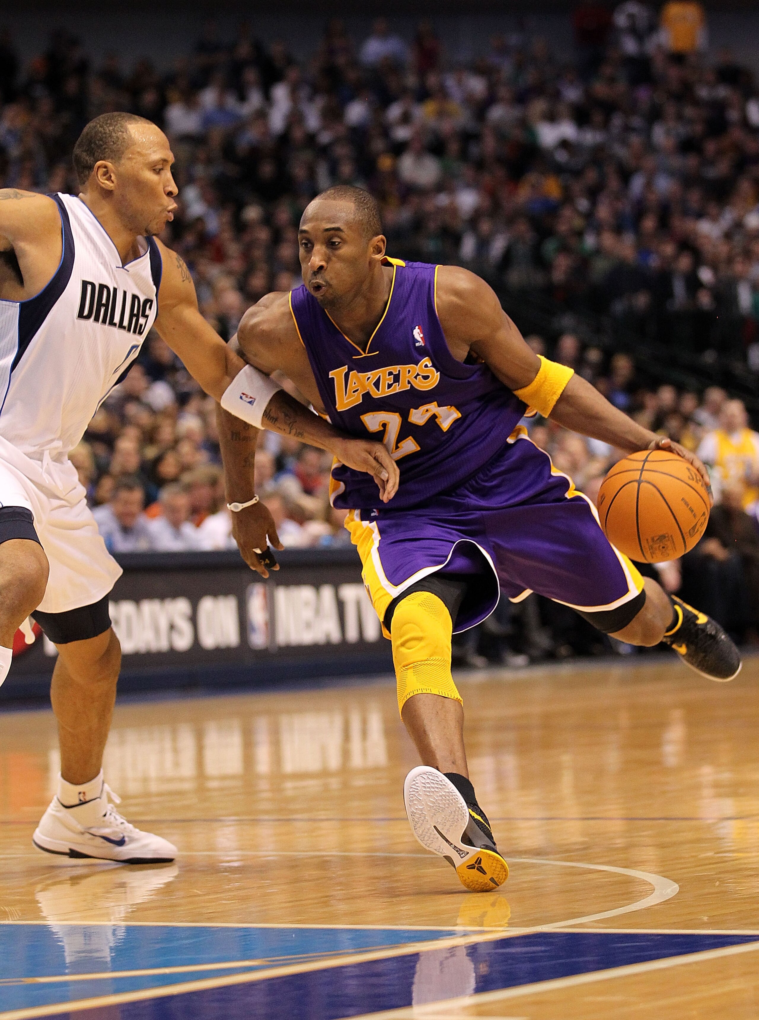 DALLAS, TX - JANUARY 19: Guard Kobe Bryant #24 of the Los Angeles Lakers dribbles the ball against Shawn Marion #0 of the Dallas Mavericks at American Airlines Center on January 19, 2011 in Dallas, Texas. NOTE TO USER: User expressly acknowledges and ag DALLAS, TX - JANUARY 19: Guard Kobe Bryant #24 of the Los Angeles Lakers dribbles the ball against Shawn Marion #0 of the Dallas Mavericks at American Airlines Center on January 19, 2011 in Dallas, Texas. NOTE TO USER: User expressly acknowledges and ag