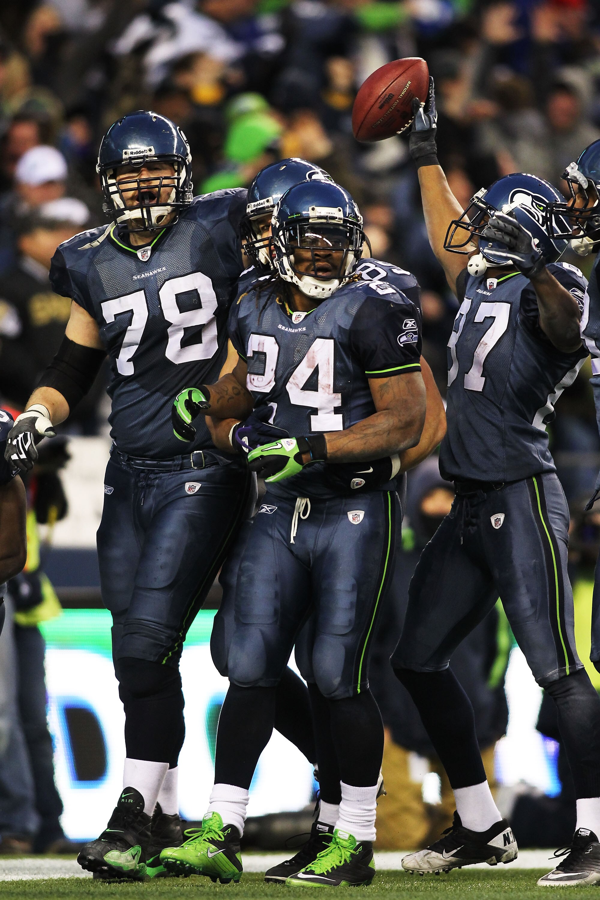 SEATTLE, WA - JANUARY 08:  Running back Marshawn Lynch #24 of the Seattle Seahawks celebrates his 67-yard touchdown run in the fourth quarter against the New Orleans Saints during the 2011 NFC wild-card playoff game at Qwest Field on January 8, 2011 in Se
