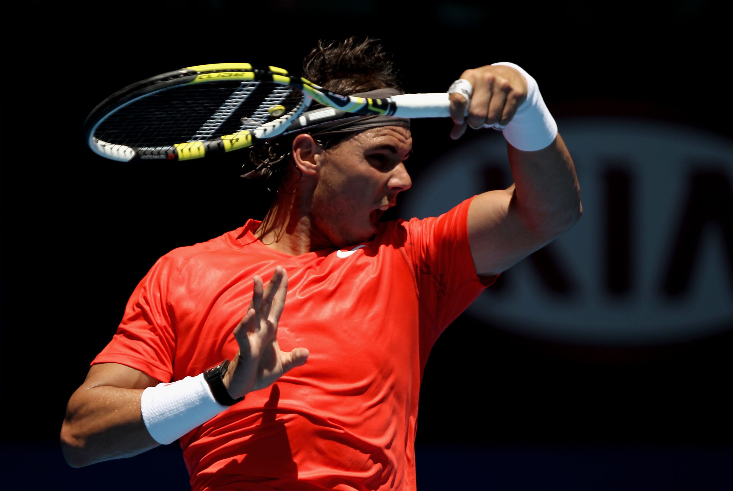 MELBOURNE, AUSTRALIA - JANUARY 20:  Rafael Nadal of Spain plays a forehand in his second round match against Ryan Sweeting of the United States of America during day four of the 2011 Australian Open at Melbourne Park on January 20, 2011 in Melbourne, Aust