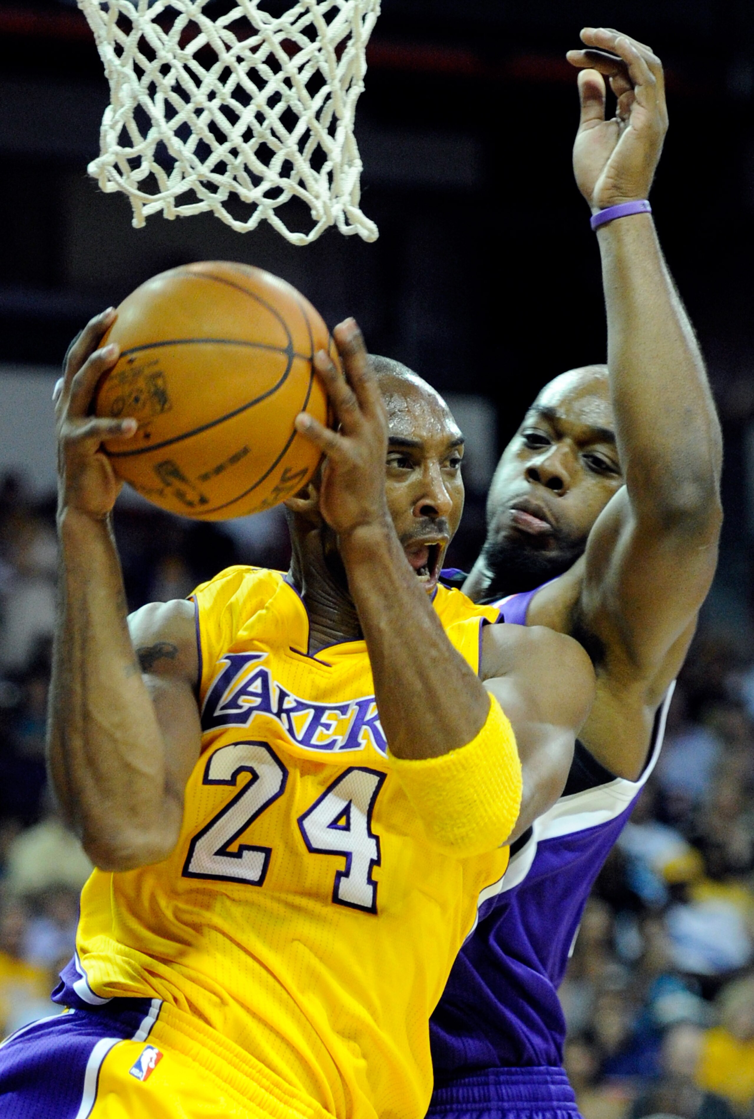 LAS VEGAS - OCTOBER 13:  Kobe Bryant #24 of the Los Angeles Lakers drives against Carl Landry #24 of the Sacramento Kings during their preseason game at the Thomas & Mack Center October 13, 2010 in Las Vegas, Nevada. The Lakers won 98-95. NOTE TO USER: Us