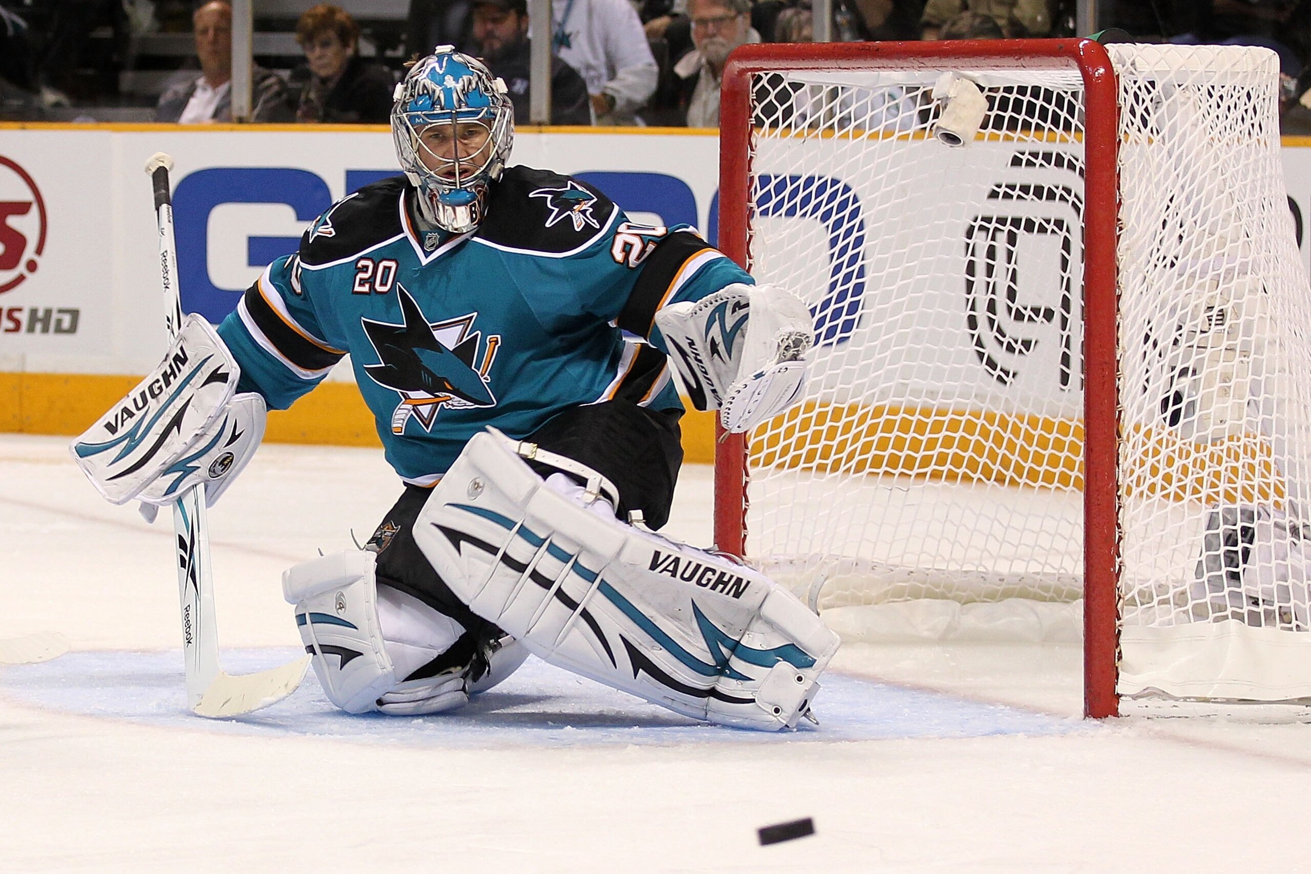SAN JOSE, CA - MAY 18:  Goaltender Evgeni Nabokov #20 of the San Jose Sharks looks at the puck while taking on the Chicago Blackhawks in Game Two of the Western Conference Finals during the 2010 NHL Stanley Cup Playoffs at HP Pavilion on May 18, 2010 in S