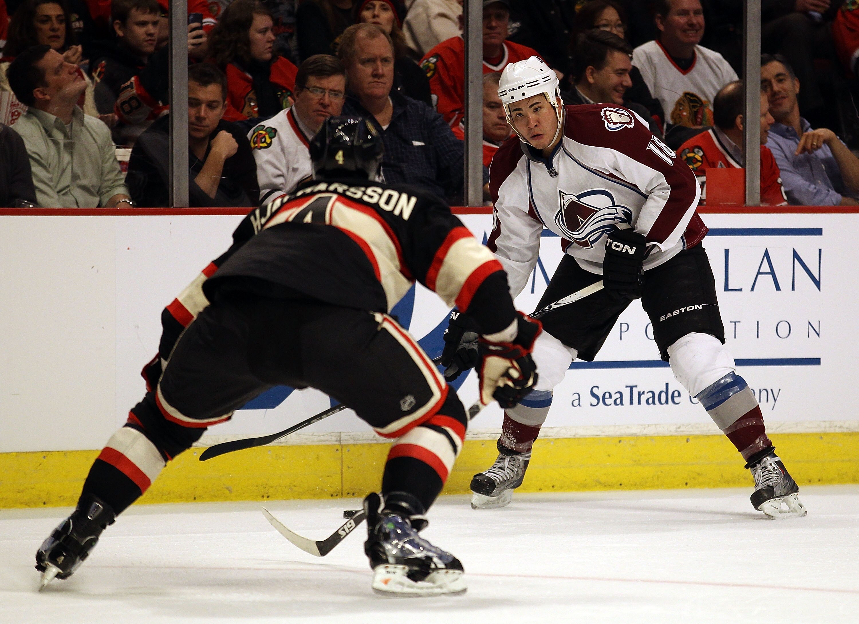 CHICAGO, IL - JANUARY 12: Brandon Yip #18 of the Colorado Avalanche prepares to take a shot past Niklas Hjalmarsson #4 of the Chicago Blackhawks at the United Center on January 12, 2011 in Chicago, Illinois. The Blackhawks defeated the Avalanche 4-0.  (Ph