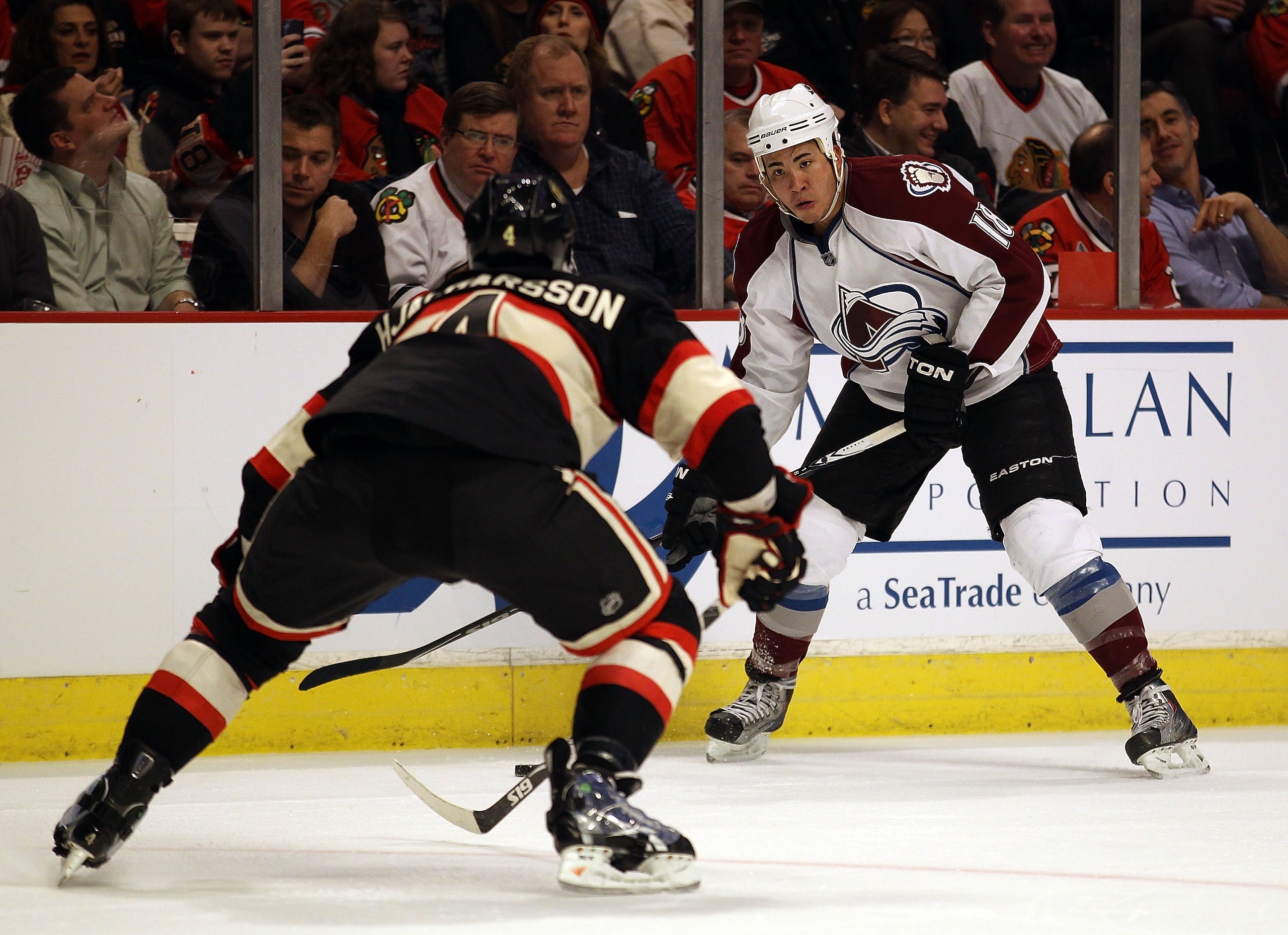 CHICAGO, IL - JANUARY 12: Brandon Yip #18 of the Colorado Avalanche prepares to take a shot past Niklas Hjalmarsson #4 of the Chicago Blackhawks at the United Center on January 12, 2011 in Chicago, Illinois. The Blackhawks defeated the Avalanche 4-0.  (Ph