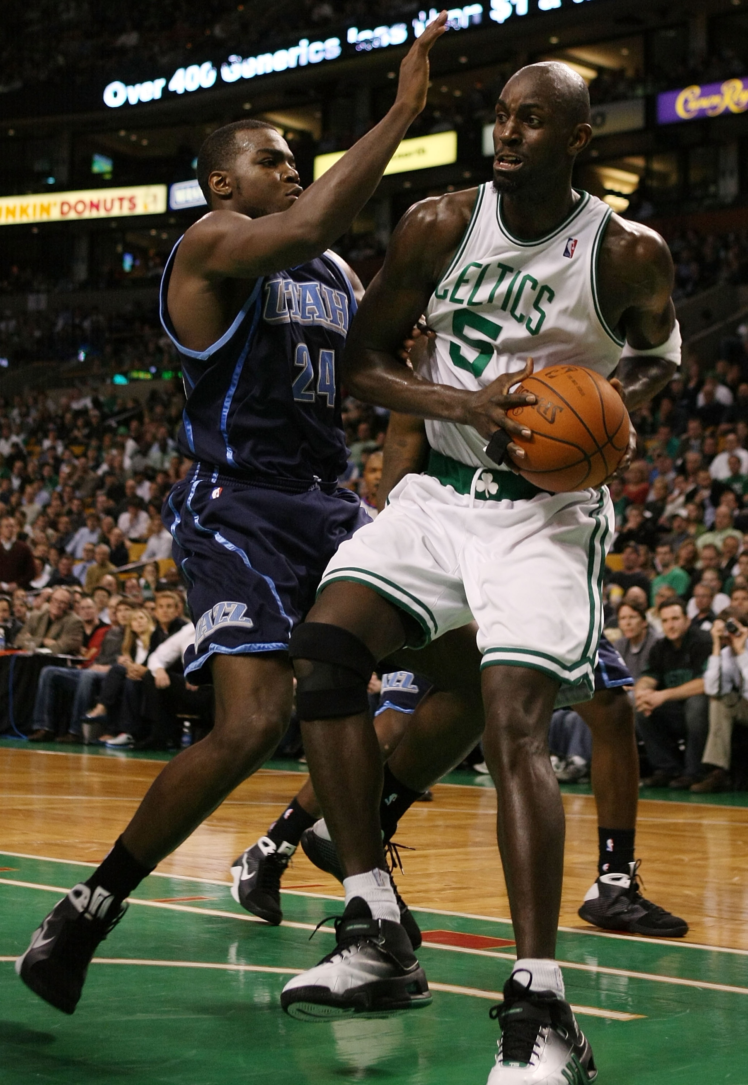 BOSTON - DECEMBER 15:  Kevin Garnett #5 of the Boston Celtics tries to get around Paul Millsap #24 of the Utah Jazz on December 15, 2008 at TD Banknorth Garden in Boston, Massachusetts. The Celtics defeated the Jazz 100-91. NOTE TO USER: User expressly ac