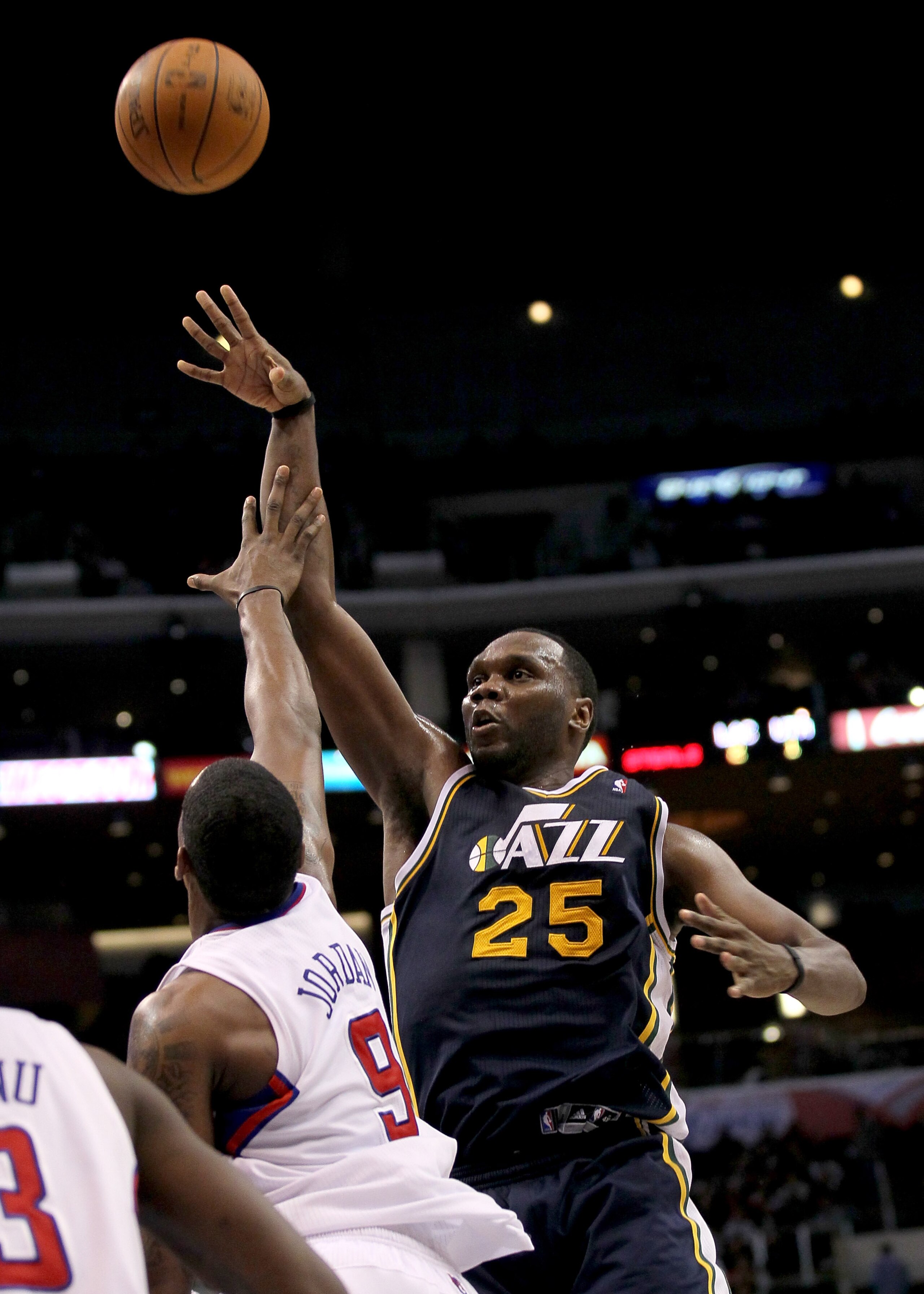 LOS ANGELES, CA - DECEMBER 29:  Al Jefferson #25 of the Utah Jazz shoots over DeAndre Jordan #9 of the Los Angeles Clippers at Staples Center on December 29, 2010 in Los Angeles, California.   The Jazz won 103-85.  NOTE TO USER: User expressly acknowledge
