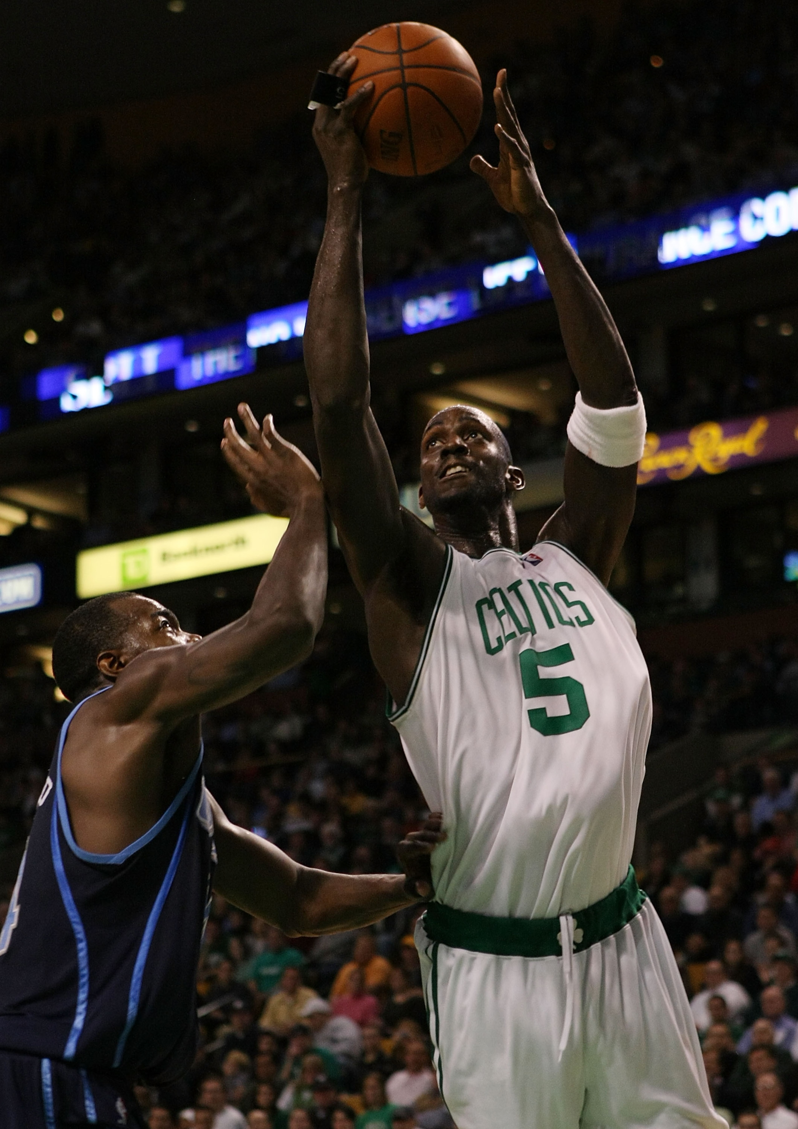 BOSTON - DECEMBER 15:  Kevin Garnett #5 of the Boston Celtics heads to the basket as Paul Millsap #24 of the Utah Jazz defends on December 15, 2008 at TD Banknorth Garden in Boston, Massachusetts. The Celtics defeated the Jazz 100-91. NOTE TO USER: User e