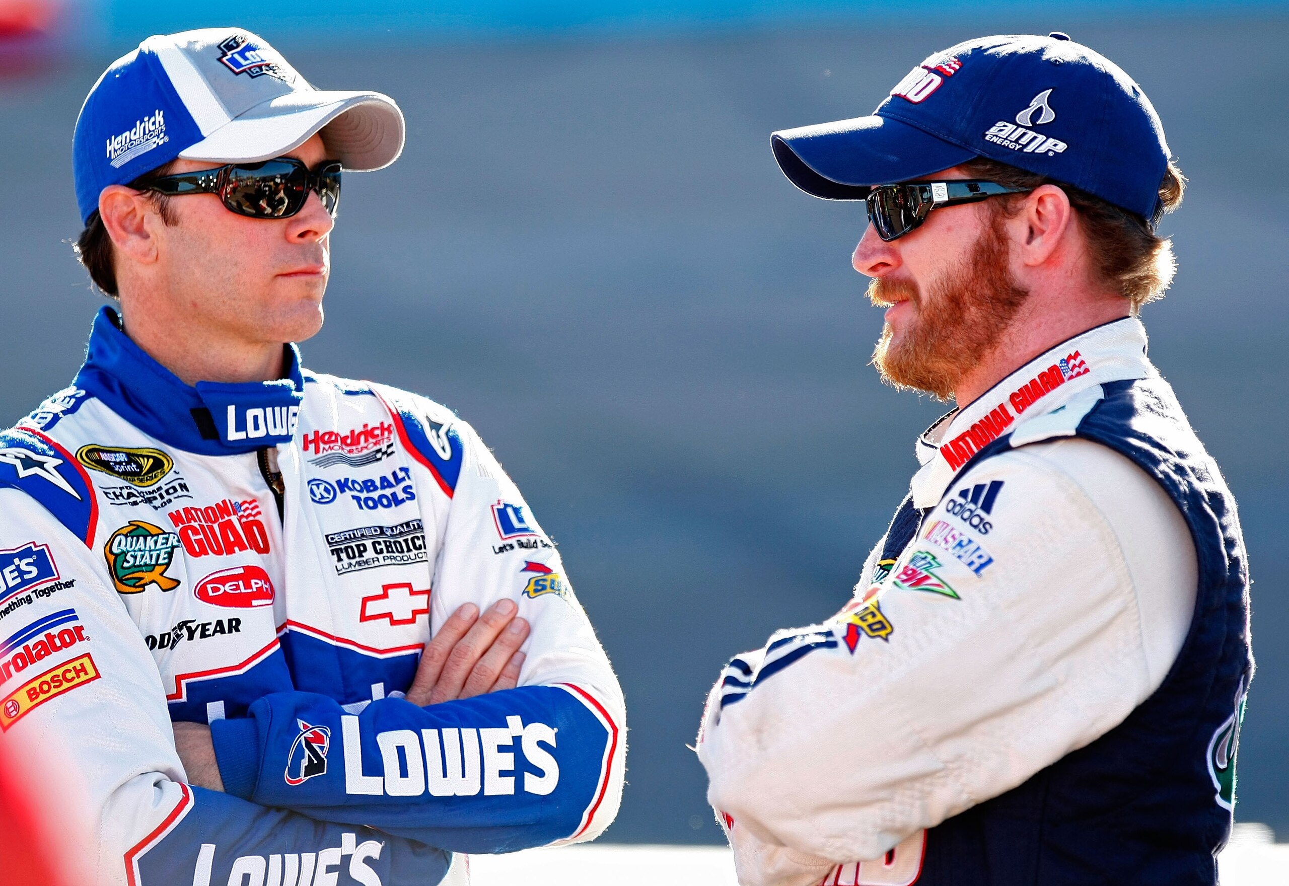 PHOENIX - APRIL 09: Jimmie Johnson (L), driver of the #48 Lowe's Chevrolet, talks with Dale Earnhardt Jr. (R), driver of the #88 National Guard/AMP Energy Chevrolet, during qualifying for the NASCAR Sprint Cup Series Subway Fresh Fit 600 at Phoenix Intern PHOENIX - APRIL 09: Jimmie Johnson (L), driver of the #48 Lowe's Chevrolet, talks with Dale Earnhardt Jr. (R), driver of the #88 National Guard/AMP Energy Chevrolet, during qualifying for the NASCAR Sprint Cup Series Subway Fresh Fit 600 at Phoenix Intern
