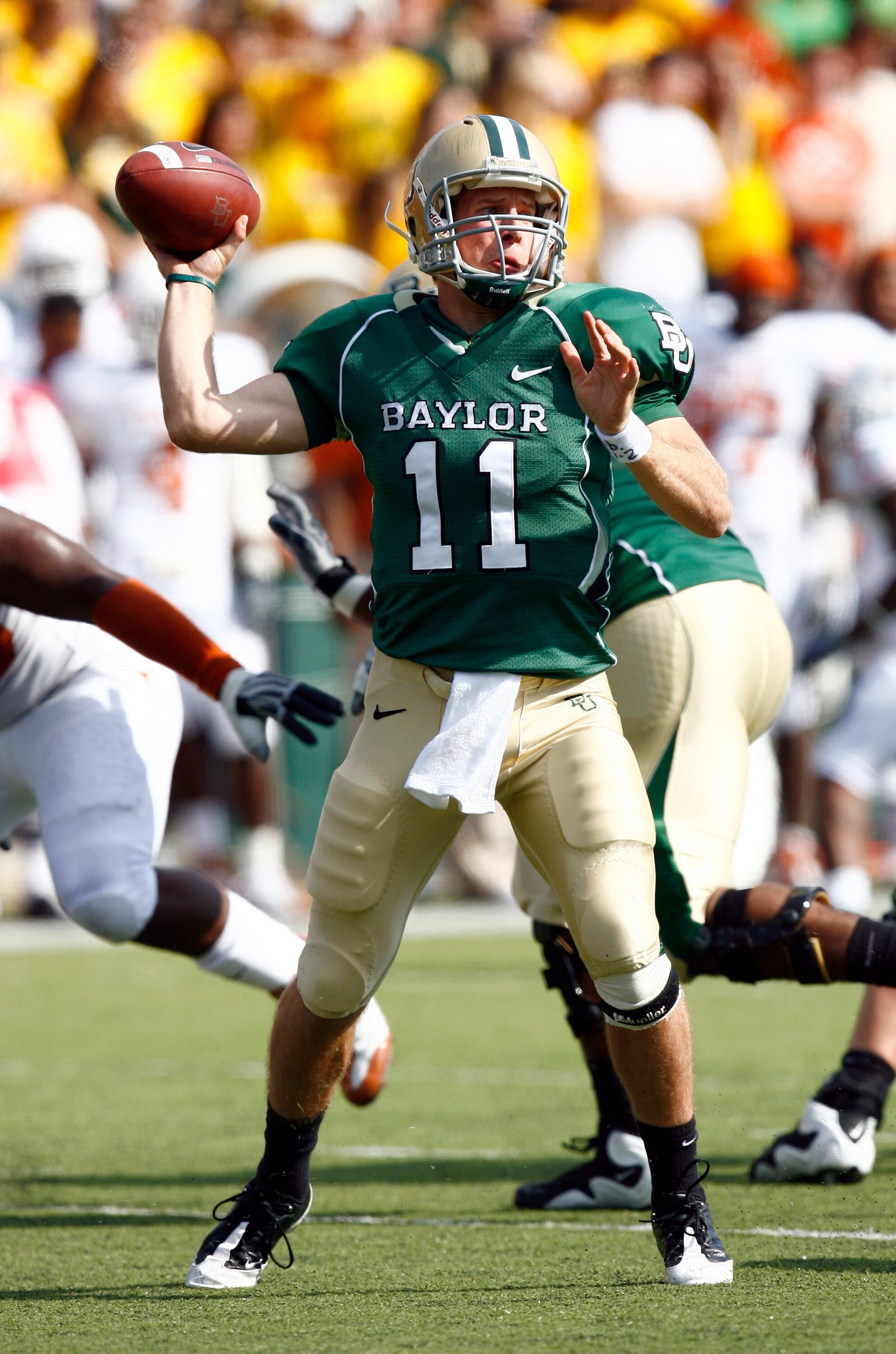 WACO, TX - NOVEMBER 14:  Quarterback Nick Florence #11 of the Baylor Bears drops back to pass during the first half against the Texas Longhorns on November 14, 2009 at Floyd Casey Stadium in Waco, Texas.  The Longhorns beat the Bears 47-14.  (Photo by Tom