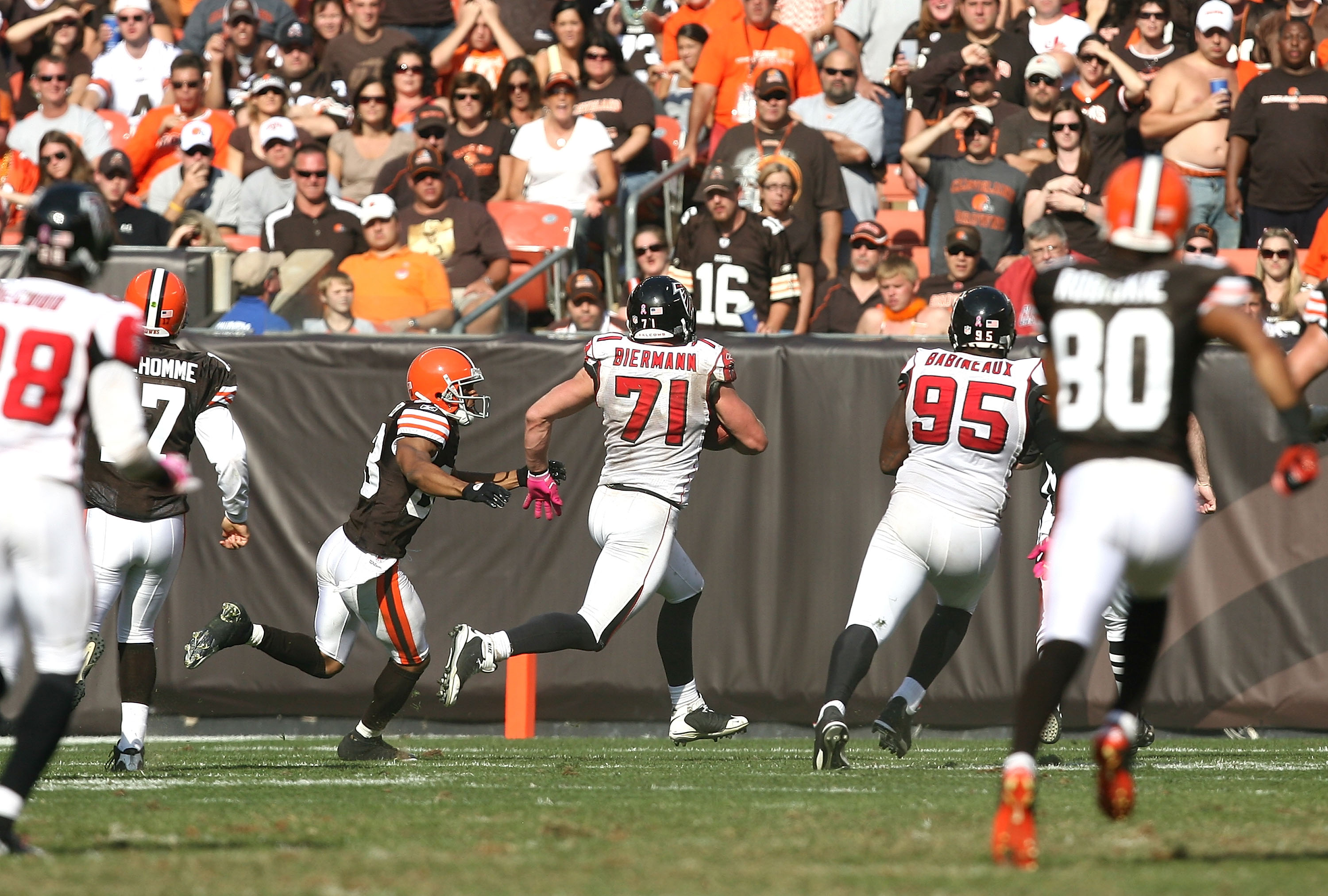 CLEVELAND - OCTOBER 10:  Outside tackle Kroy Biermann #71 of the Atlanta Falcons scores a touchdown after intercepting the ball against the Cleveland Browns at Cleveland Browns Stadium on October 10, 2010 in Cleveland, Ohio.  (Photo by Matt Sullivan/Getty