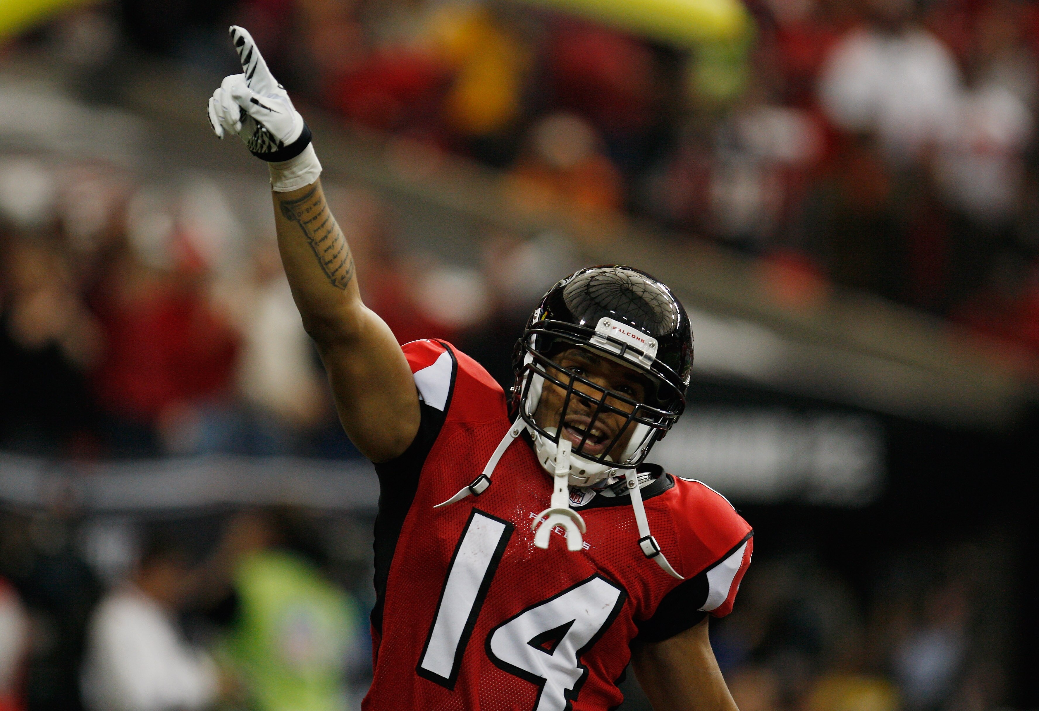 ATLANTA, GA - JANUARY 02:  Eric Weems #14 of the Atlanta Falcons celebrates after his 55-yard punt return for a first quarter touchdown during the game against the Carolina Panthers at the Georgia Dome on January 2, 2011 in Atlanta, Georgia.  (Photo by Sc
