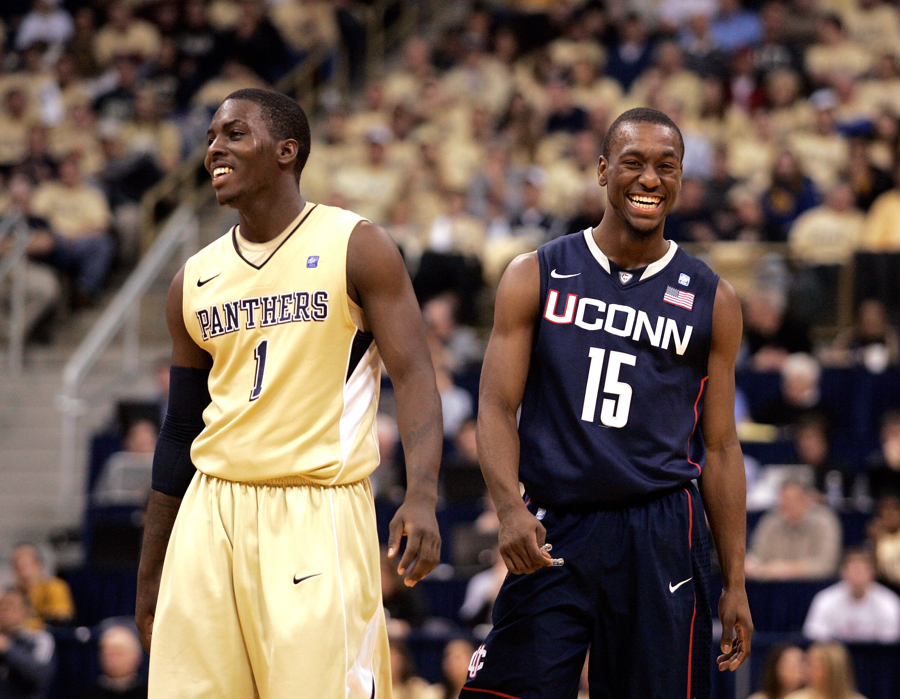 PITTSBURGH, PA - DECEMBER 27:  Travon Woodall #1 of the Pittsburgh Panthers and Kemba Walker #15 of the Connecticut Huskies have a laugh at Petersen Events Center on December 27, 2010 in Pittsburgh, Pennsylvania.  Pittsburgh defeated Connecticut 78-64.  (