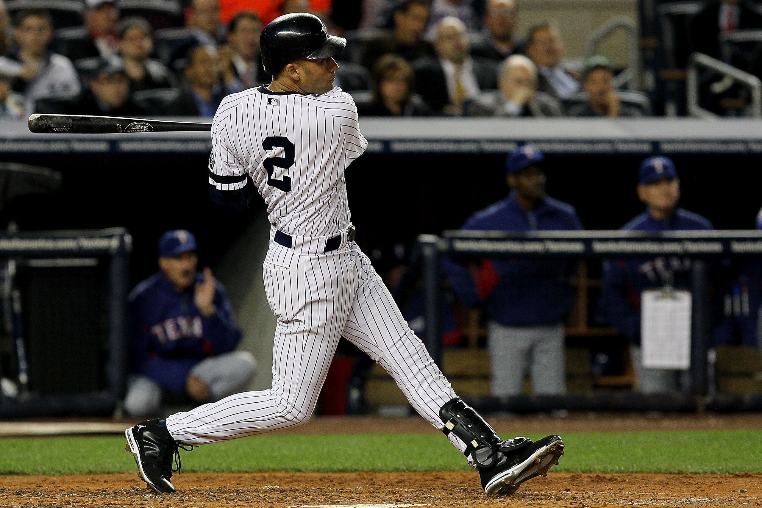 NEW YORK - OCTOBER 19: Derek Jeter #2 of the New York Yankees hits a triple in the third inning against the Texas Rangers in Game Four of the ALCS during the 2010 MLB Playoffs at Yankee Stadium on October 19, 2010 in the Bronx borough of New York City. NEW YORK - OCTOBER 19: Derek Jeter #2 of the New York Yankees hits a triple in the third inning against the Texas Rangers in Game Four of the ALCS during the 2010 MLB Playoffs at Yankee Stadium on October 19, 2010 in the Bronx borough of New York City.
