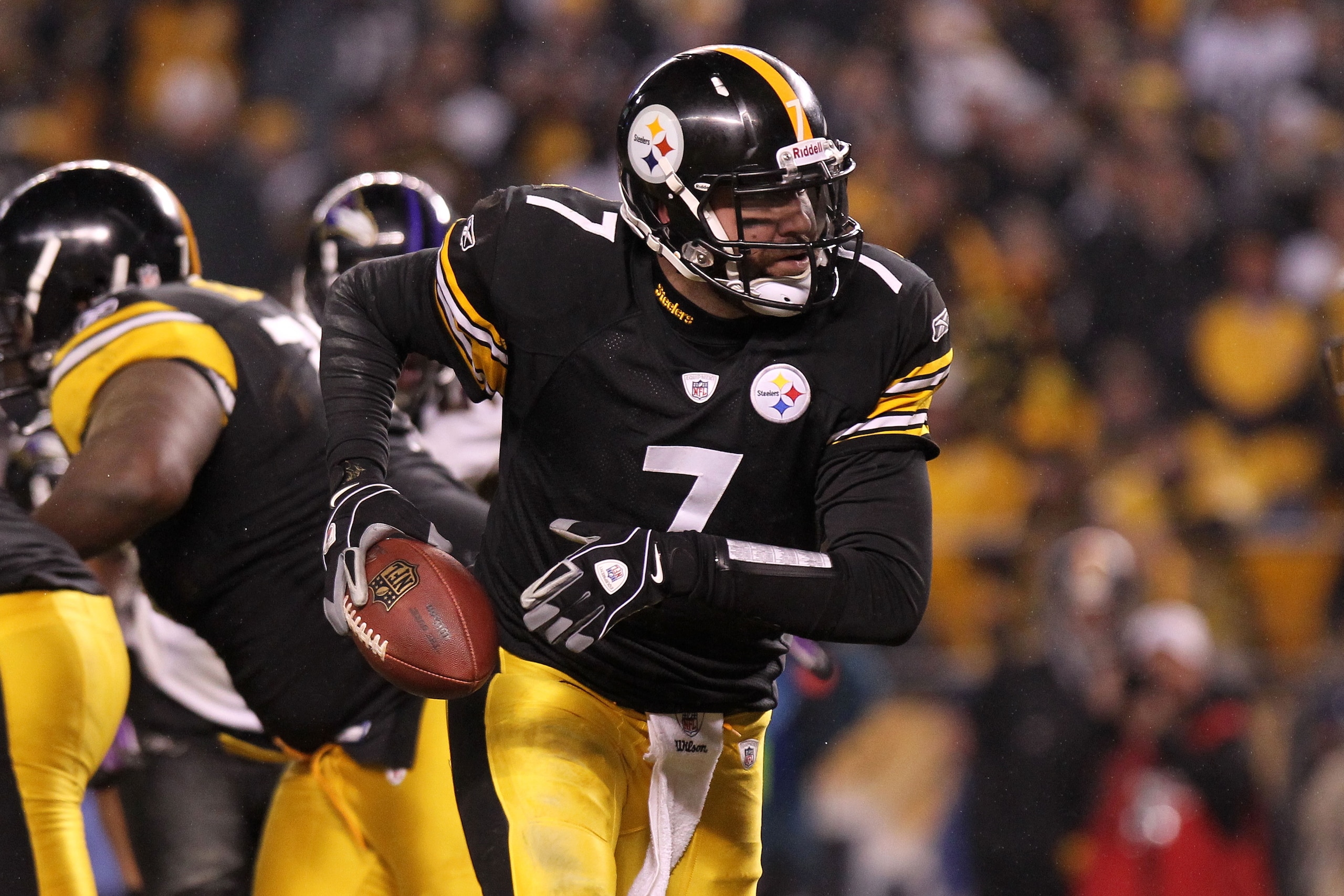 PITTSBURGH, PA - JANUARY 15:  Quarterback Ben Roethlisberger #7 of the Pittsburgh Steelers rolls out of the pocket against the Baltimore Ravens in the AFC Divisional Playoff Game at Heinz Field on January 15, 2011 in Pittsburgh, Pennsylvania.  (Photo by N