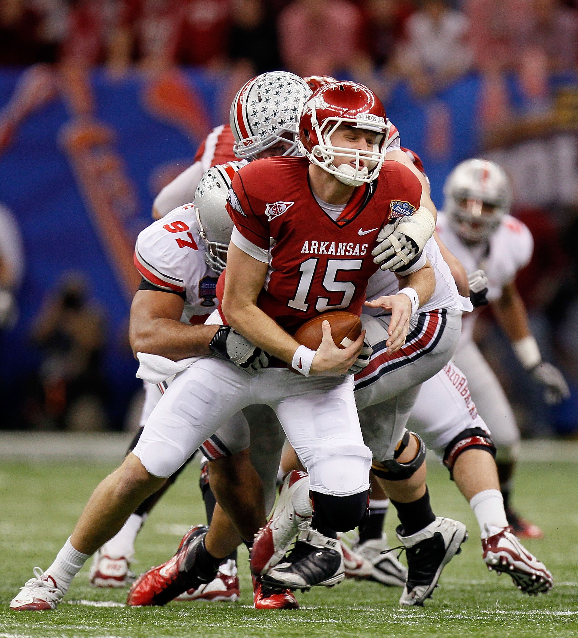 NEW ORLEANS, LA - JANUARY 04:  Quarterback Ryan Mallett #15 of the Arkansas Razorbacks is sacked by Cameron Heyward #97 and Dexter Larimore #72 of the Ohio State Buckeyes in the fourth quarter during the Allstate Sugar Bowl at the Louisiana Superdome on J