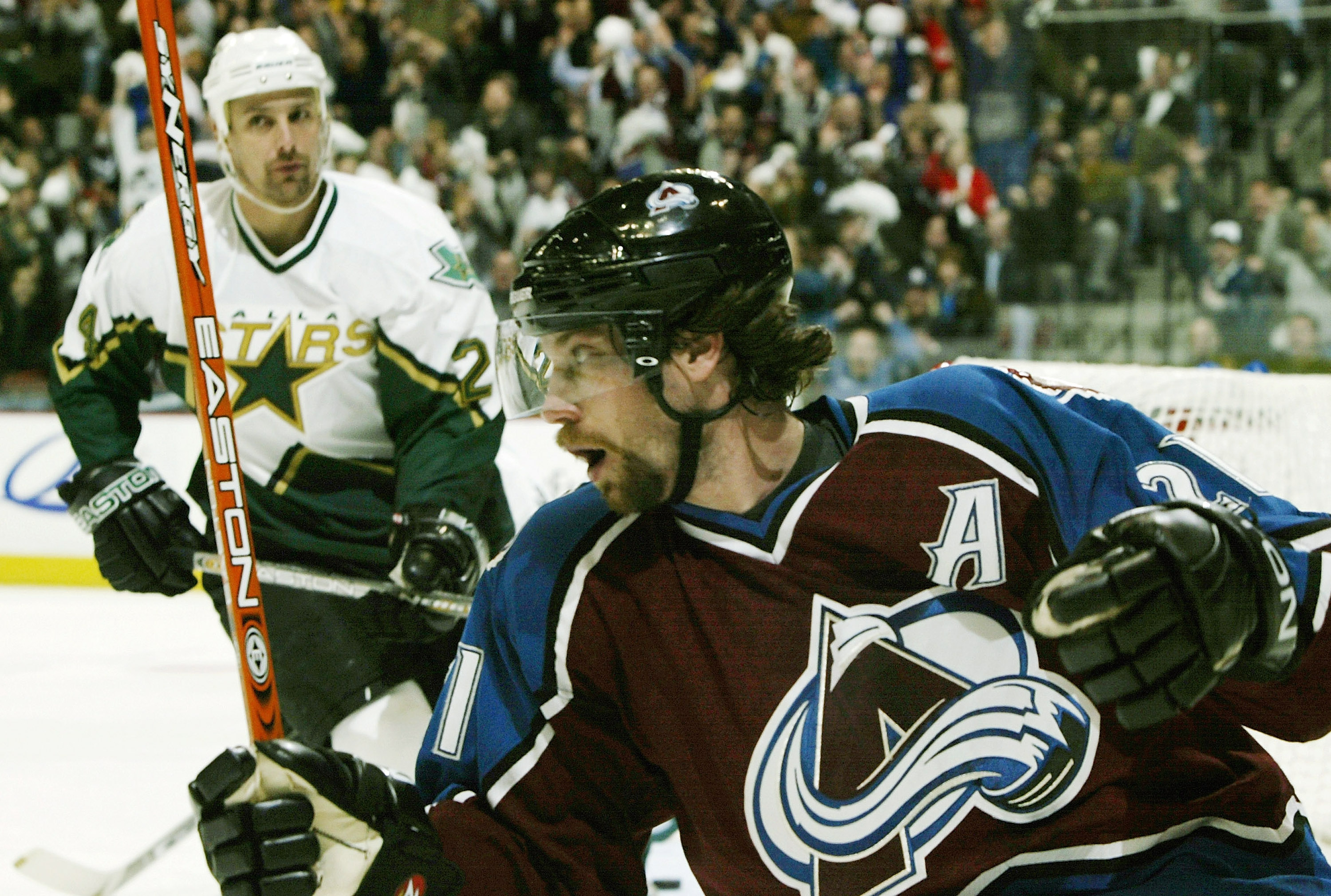 DENVER - APRIL 7:  Peter Forsberg #21 of the Colorado Avalanche celebrates a two-on-one goal by Alex Tanguay #18 against the Dallas Stars in the first period of the first round of the Stanley Cup playoffs at the Pepsi Center on April 7, 2004 in Denver, Co