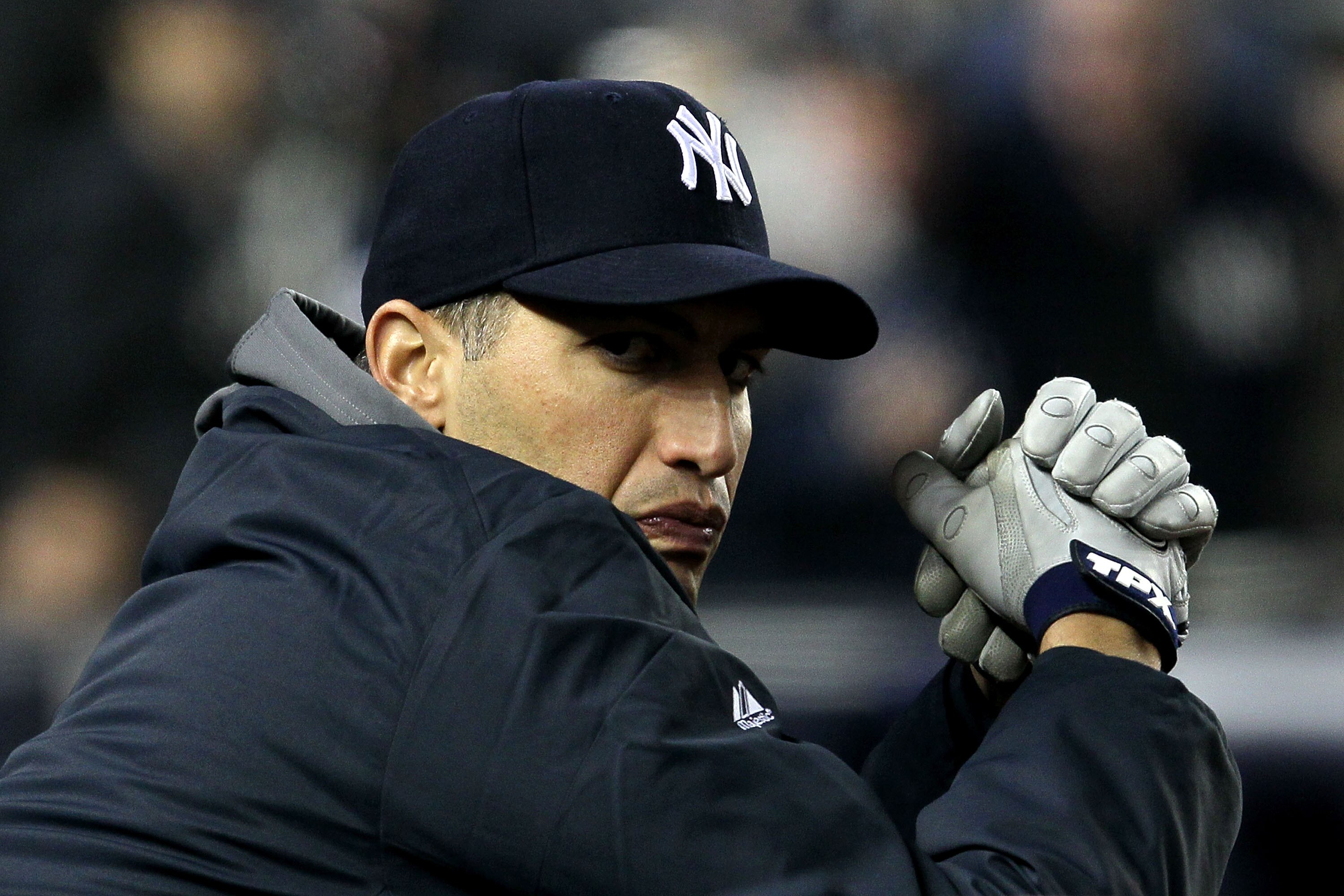 NEW YORK - OCTOBER 19:  Andy Pettitte #46 of the New York Yankees looks on from the dugout against the Texas Rangers in Game Four of the ALCS during the 2010 MLB Playoffs at Yankee Stadium on October 19, 2010 in the Bronx borough of New York City.  (Photo