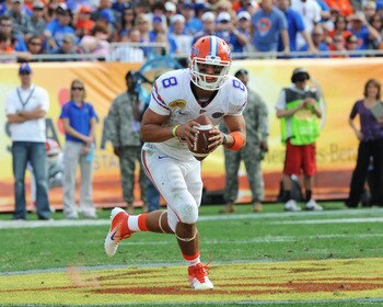 TAMPA, FL - JANUARY 1:  Quarterback Trey Burton #8  of the Florida Gators rushes upfield against the Penn State Nittany Lions January 1, 2010 in the 25th Outback Bowl at Raymond James Stadium in Tampa, Florida.  (Photo by Al Messerschmidt/Getty Images)