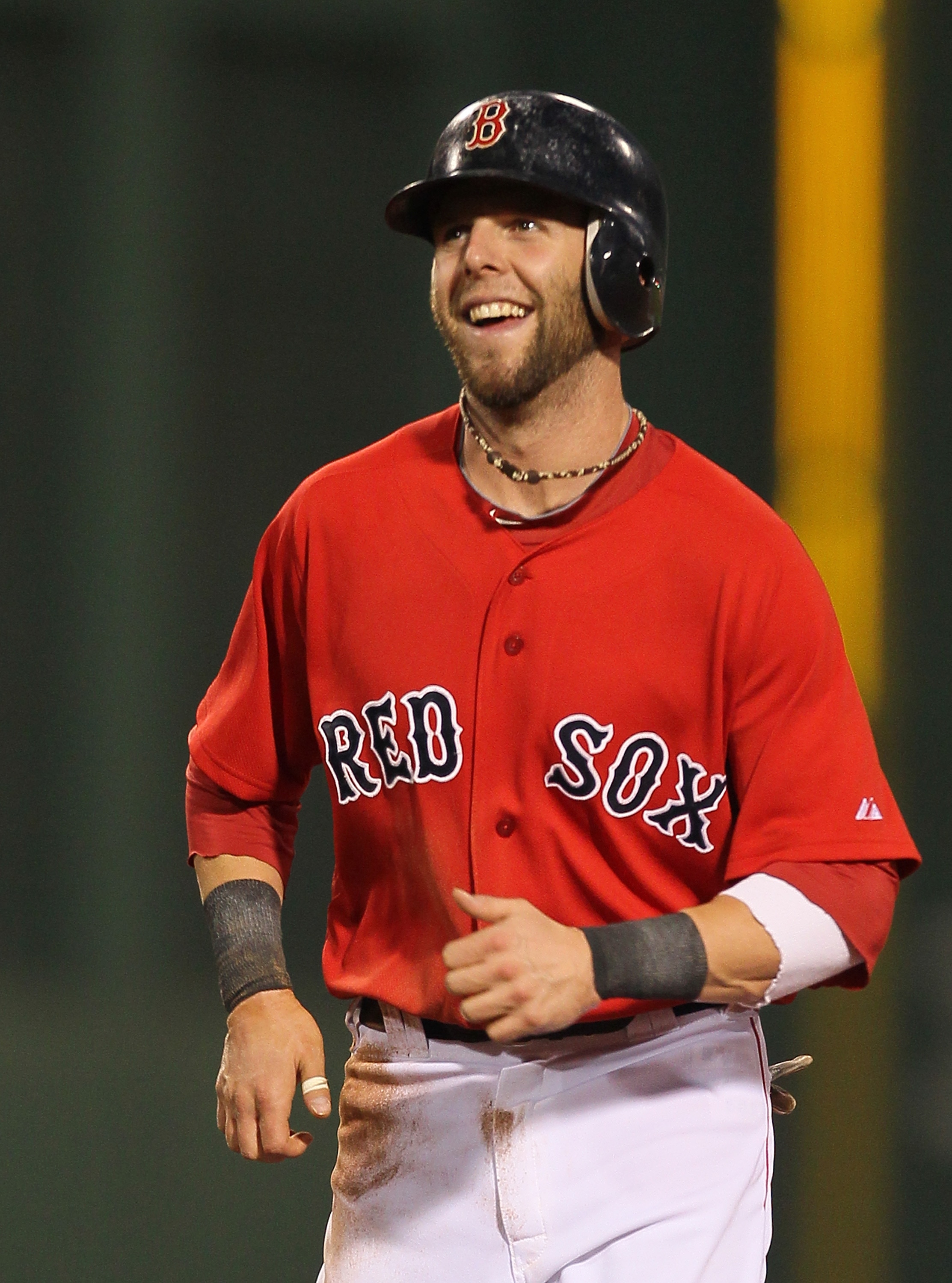 BOSTON - JUNE 18:  Dustin Pedroia #15 of the Boston Red Sox reacts during a game against the Los Angeles Dodgers at Fenway Park on June 18, 2010 in Boston, Massachusetts. (Photo by Jim Rogash/Getty Images)