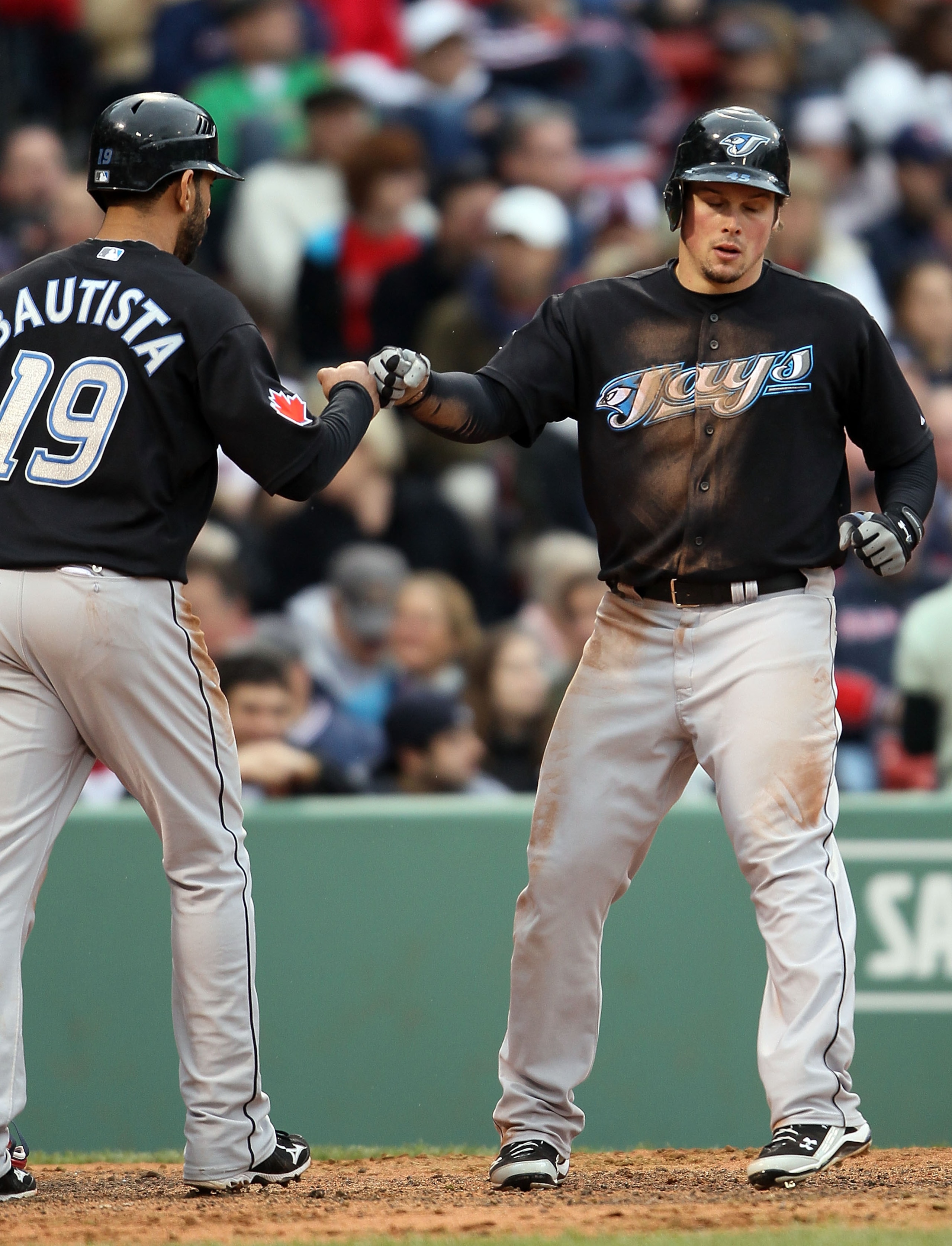 BOSTON - MAY 12:  Travis Snider #45 of the Toronto Blue Jays celebrates his two run homer with teammate Jose Bautista #19 in the seventh inning against the Boston Red Sox on May 12, 2010 at Fenway Park in Boston, Massachusetts.  (Photo by Elsa/Getty Image