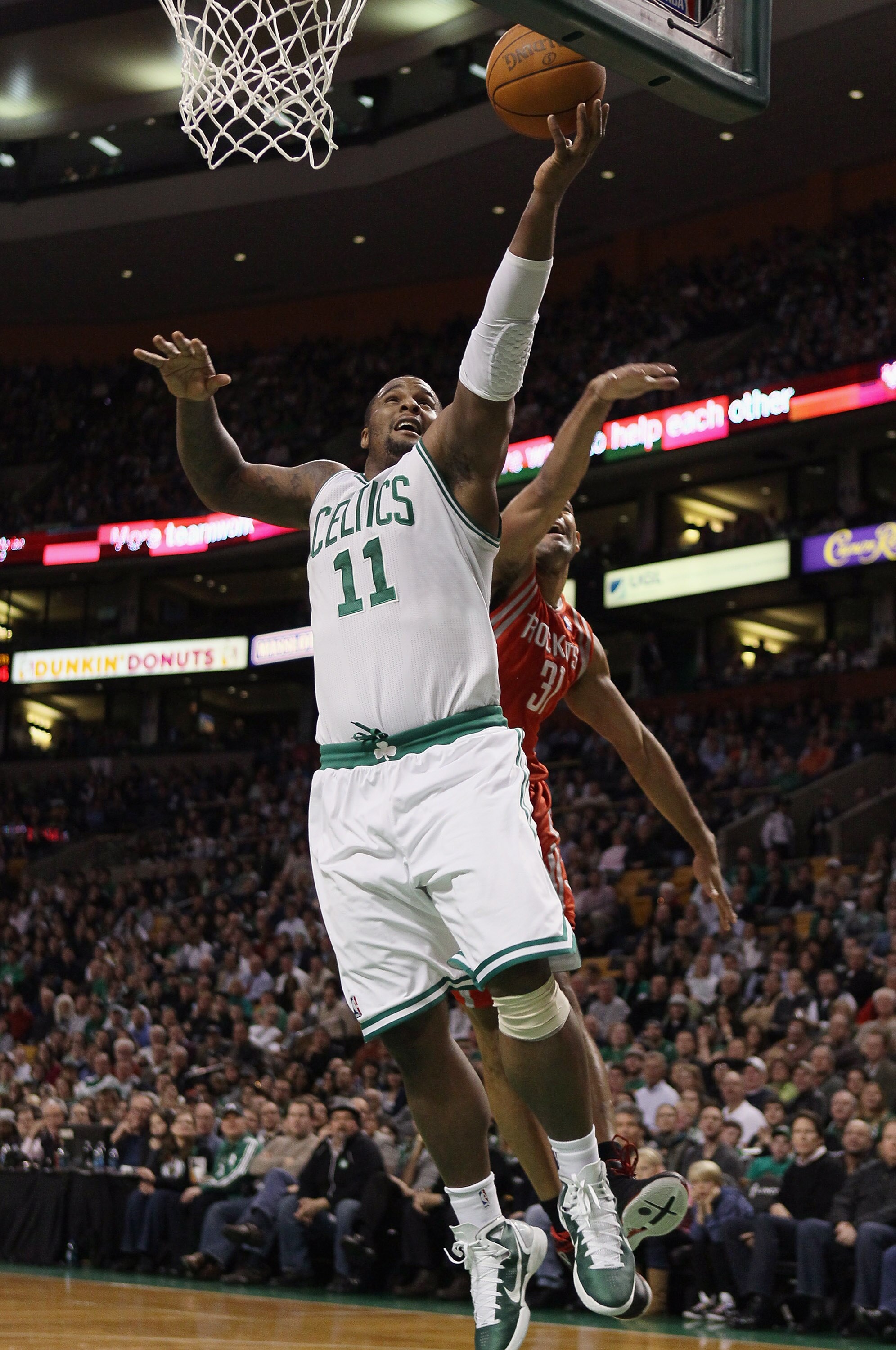 BOSTON, MA - JANUARY 10:  Glen Davis #11 of the Boston Celtics heads to the net as Shane Battier #31 of the Houston Rockets defends on January 10, 2011 at the TD Garden in Boston, Massachusetts.  NOTE TO USER: User expressly acknowledges and agrees that,