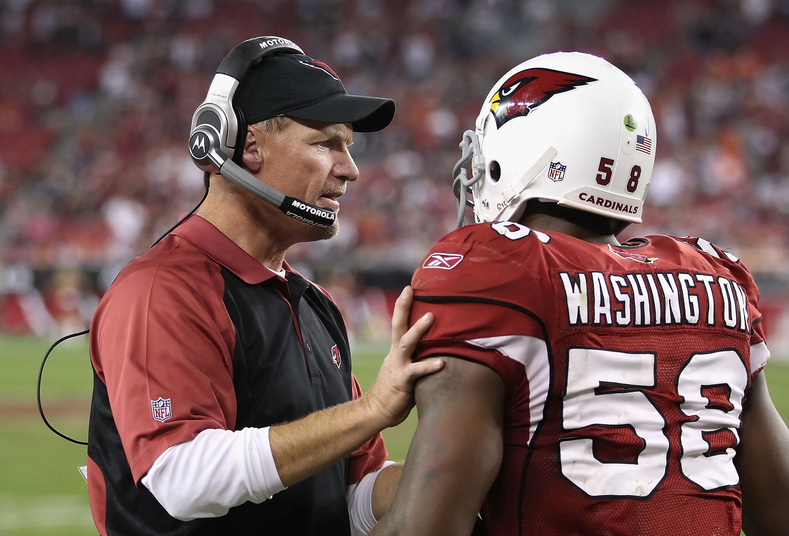 GLENDALE, AZ - DECEMBER 12:   Head coach  Ken Whisenhunt of the Arizona Cardinals talks with Daryl Washington #58 after he scored on a 40 touchdown interception against the Denver Broncos during the fourth quarter of the NFL game at the University of Phoe