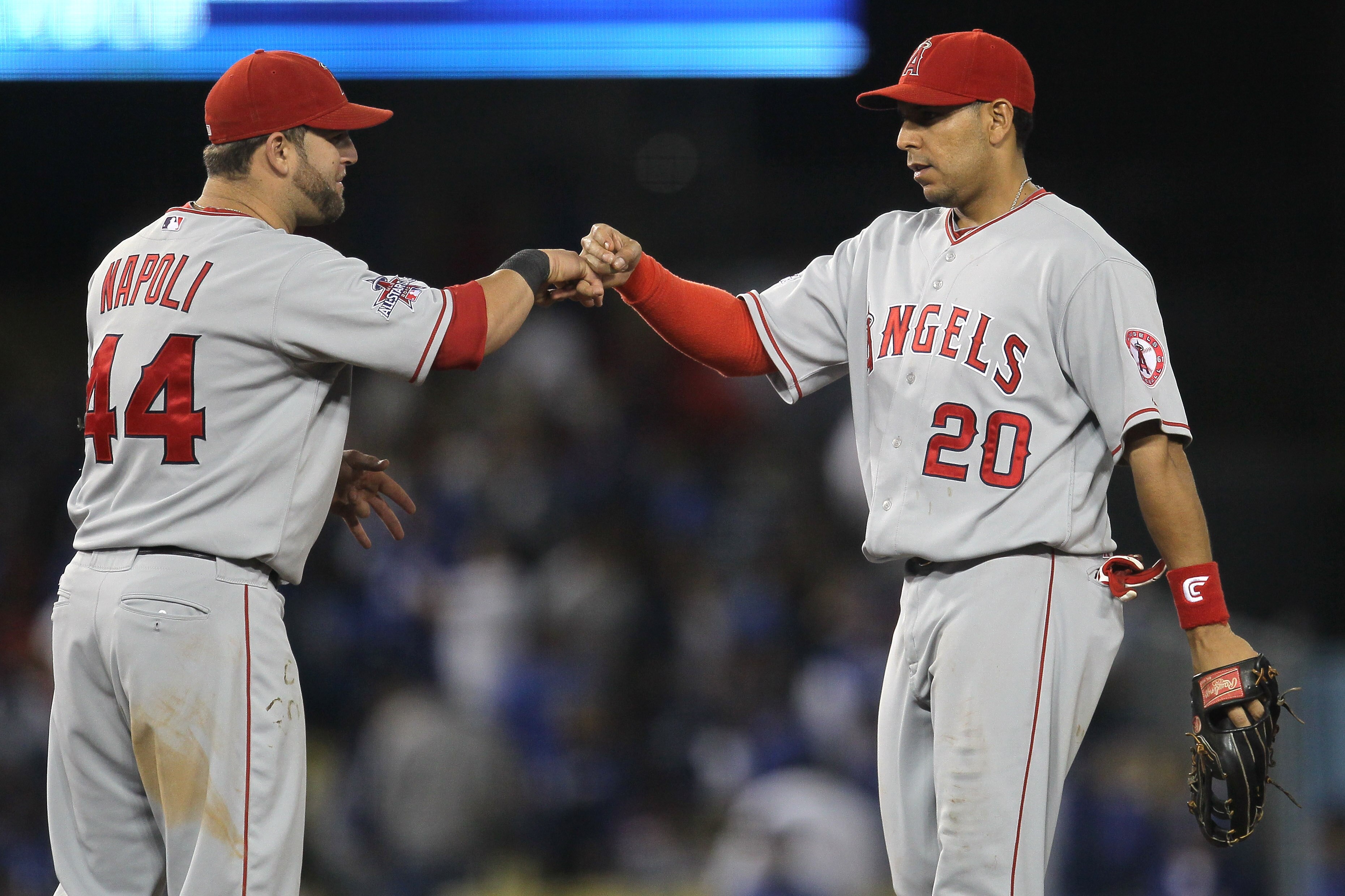 LOS ANGELES - JUNE 12:  Juan Rivera #20 and Mike Napoli #44 of the Los Angeles Angels of Anaheim celebrate after the game with the Los Angeles Dodgers on June 12, 2010 at Dodger Stadium in Los Angeles, California.  The Angels won 4-2.   (Photo by Stephen